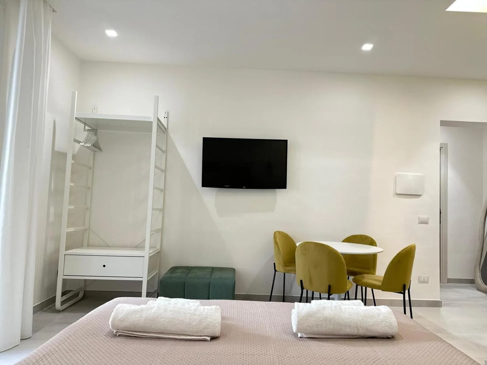 Bed in I Faraglioni Comfort Rooms