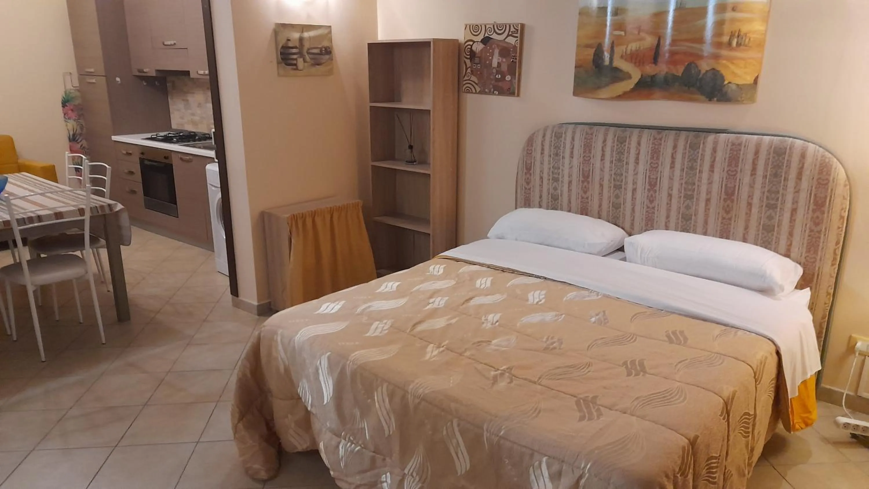 Bed in I Faraglioni Comfort Rooms