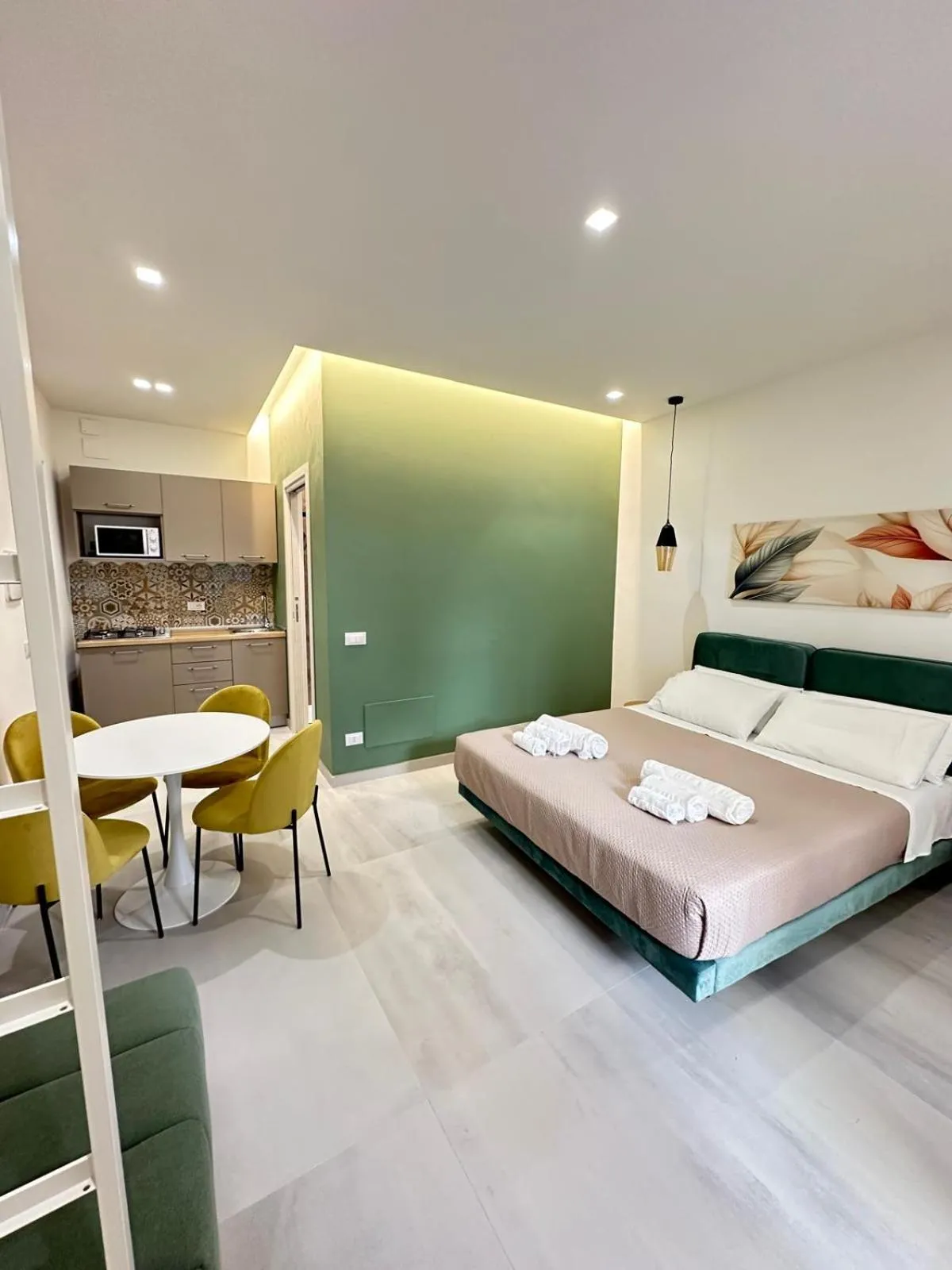Bed in I Faraglioni Comfort Rooms