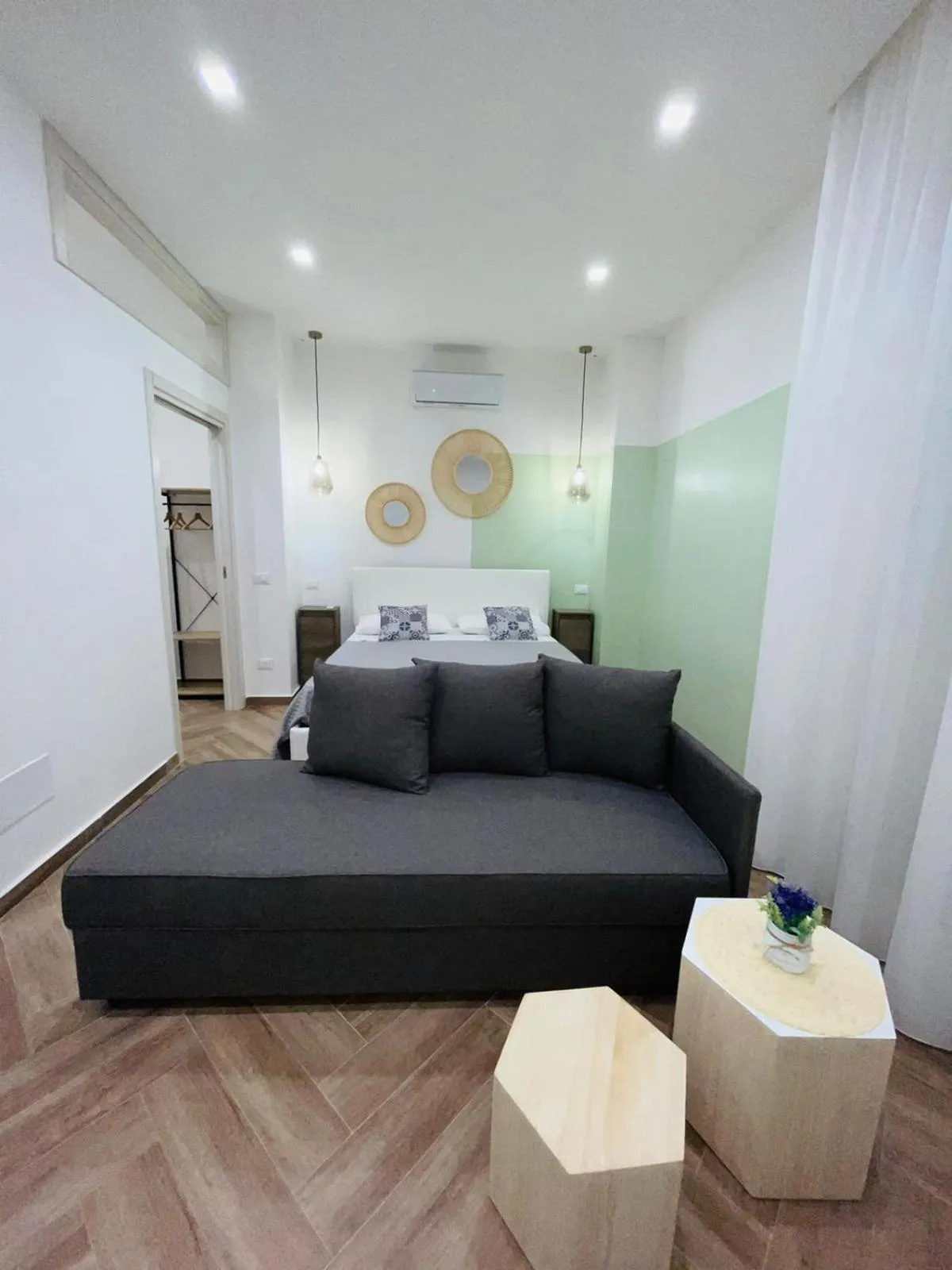 Bed in I Faraglioni Comfort Rooms