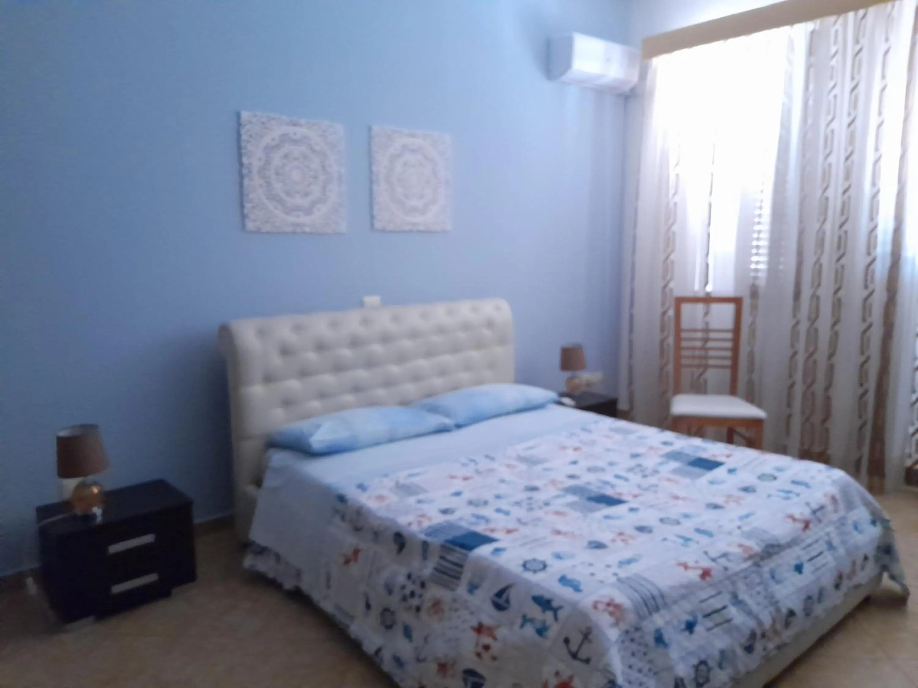 Bed in I Faraglioni Comfort Rooms