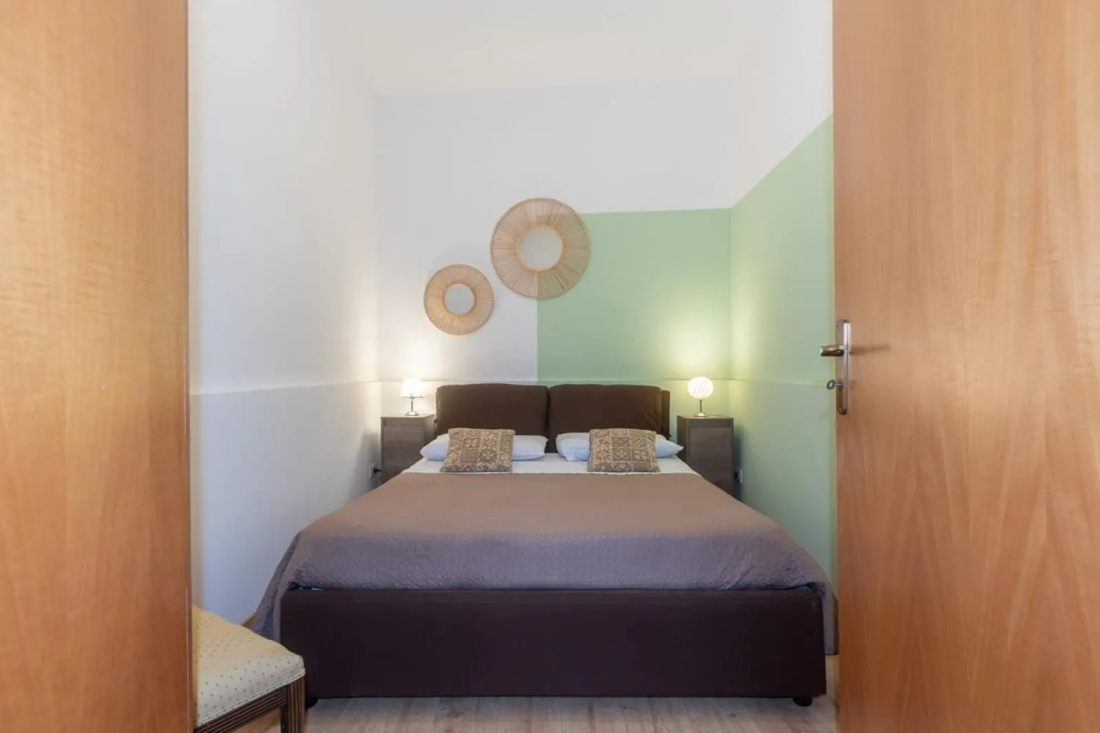 Bed in I Faraglioni Comfort Rooms