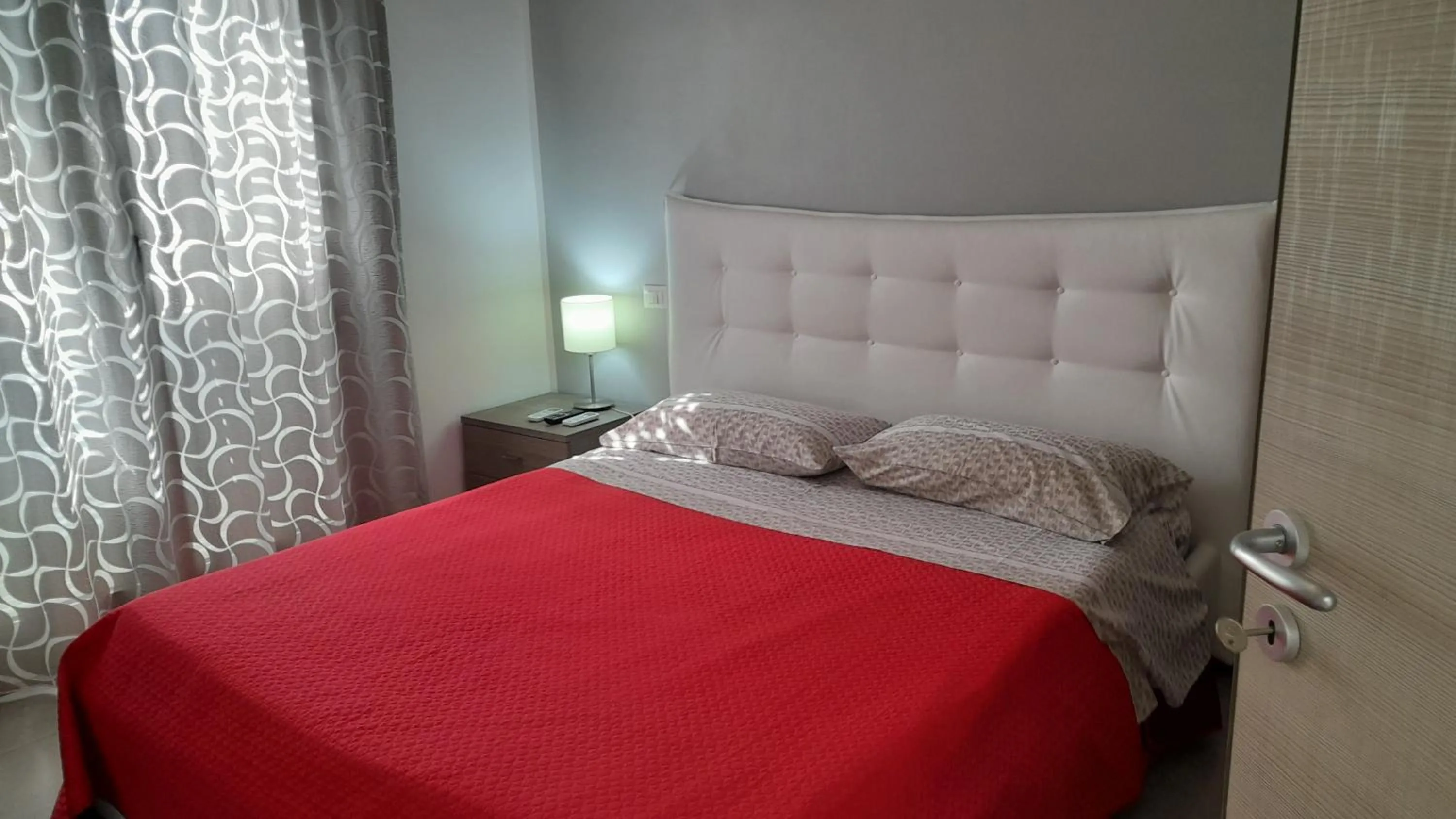 Bed in I Faraglioni Comfort Rooms