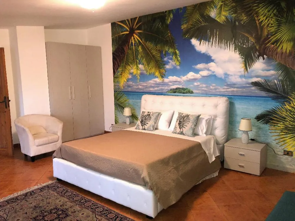 Bed in I Faraglioni Comfort Rooms