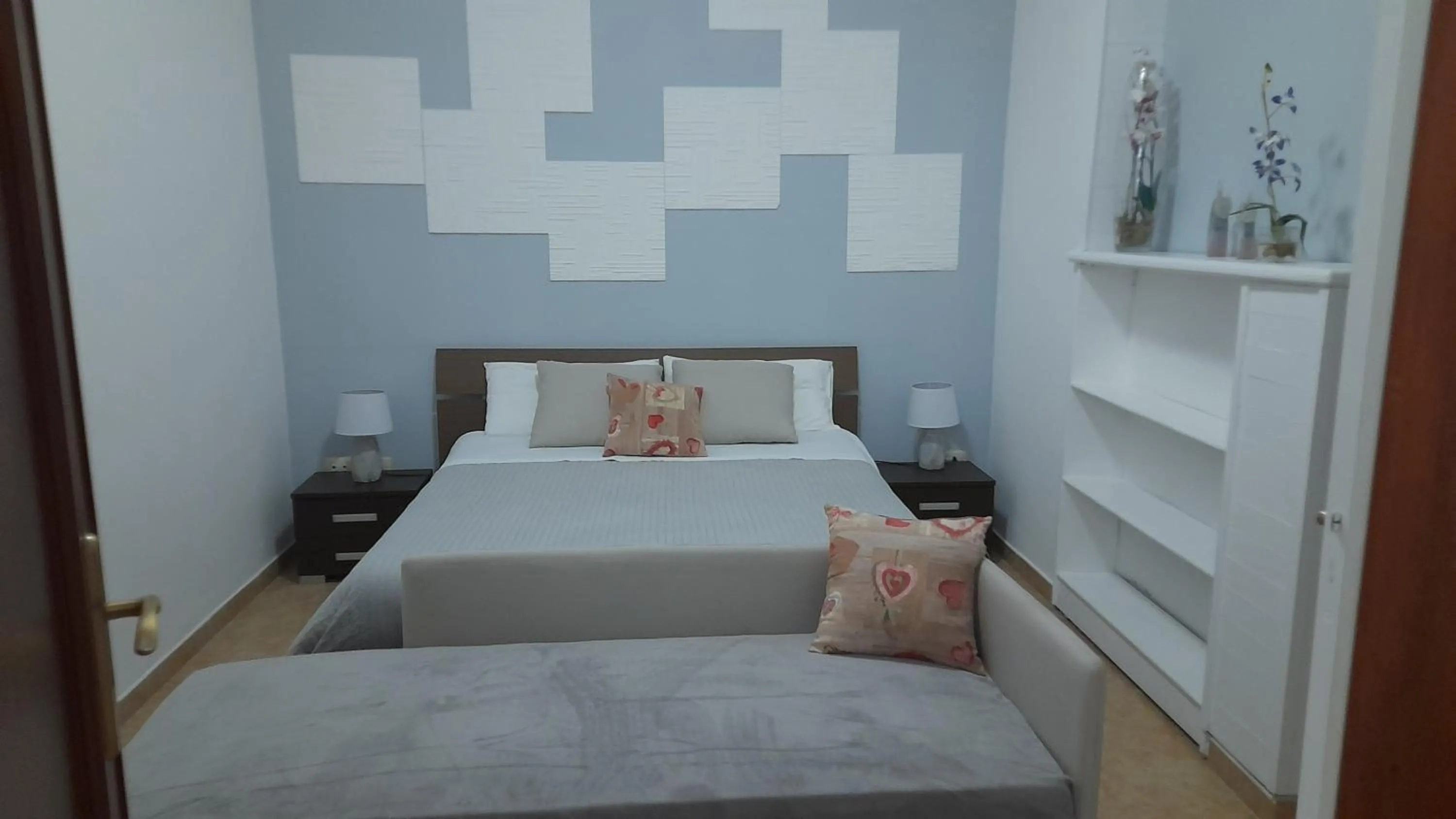 Bed in I Faraglioni Comfort Rooms