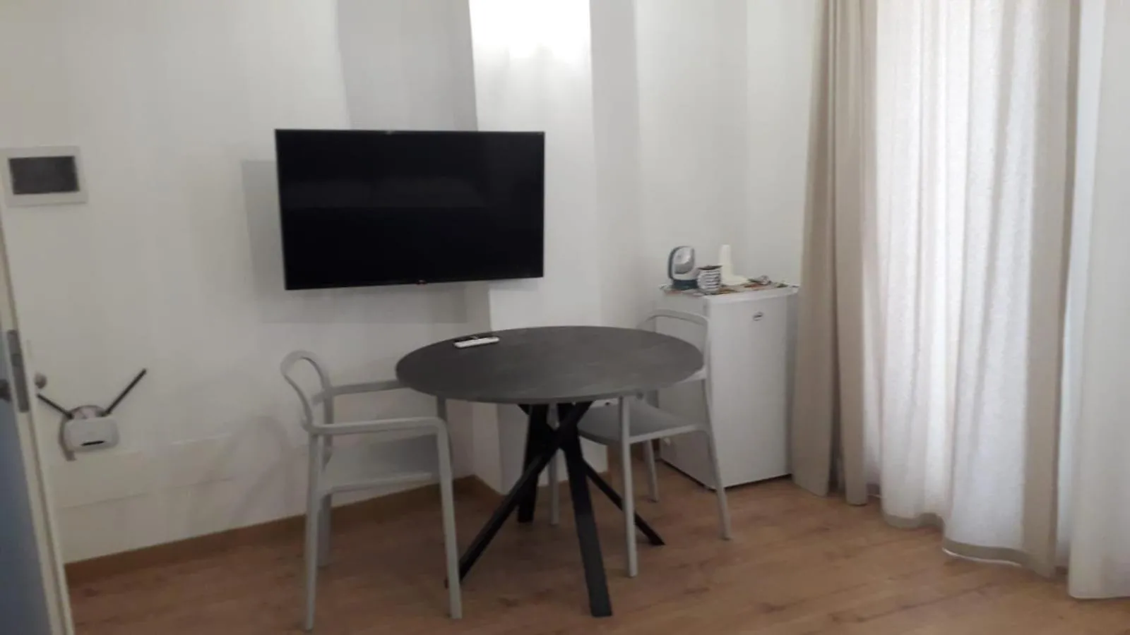 Seating area in I Faraglioni Comfort Rooms