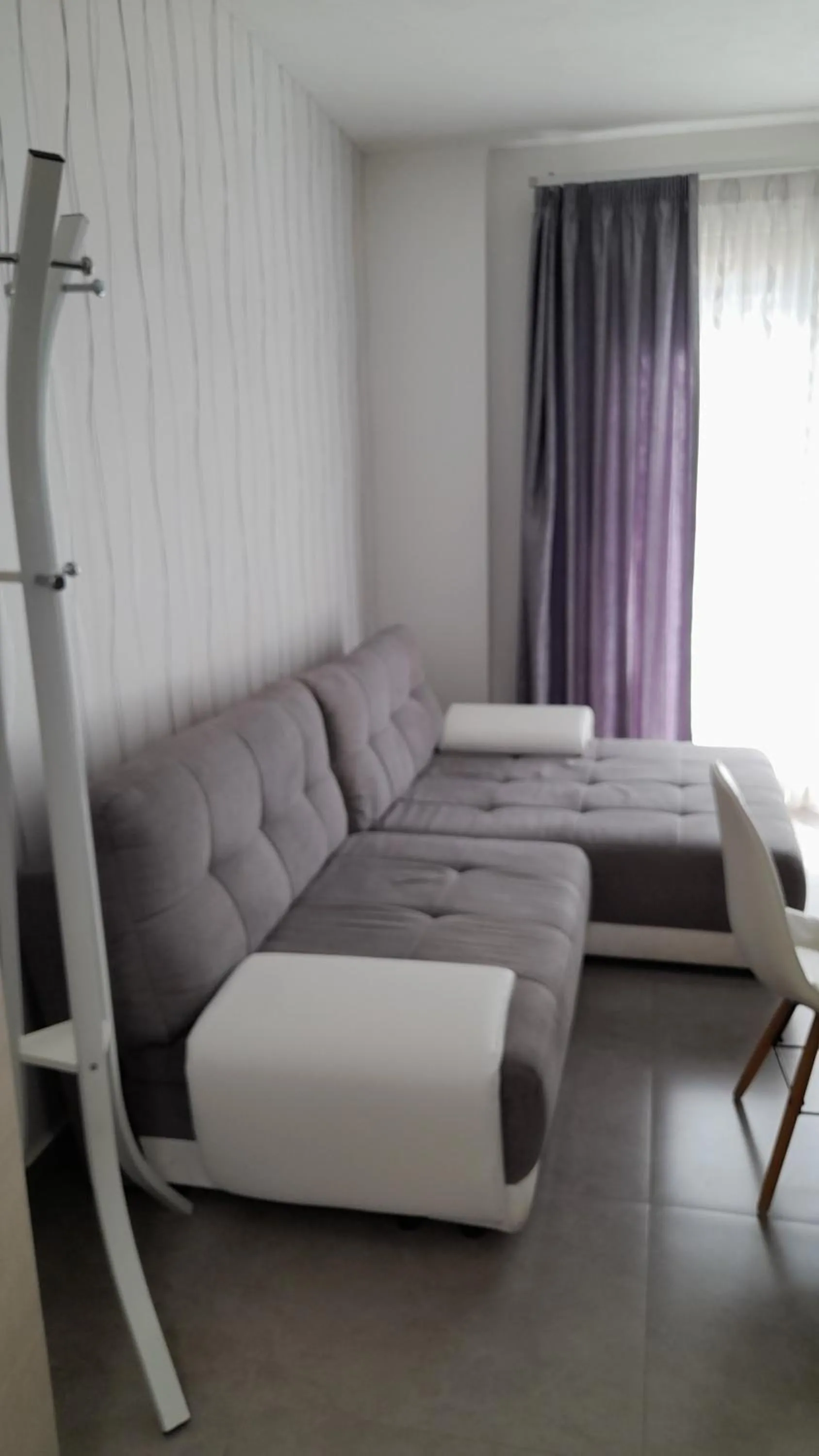 Bed in I Faraglioni Comfort Rooms