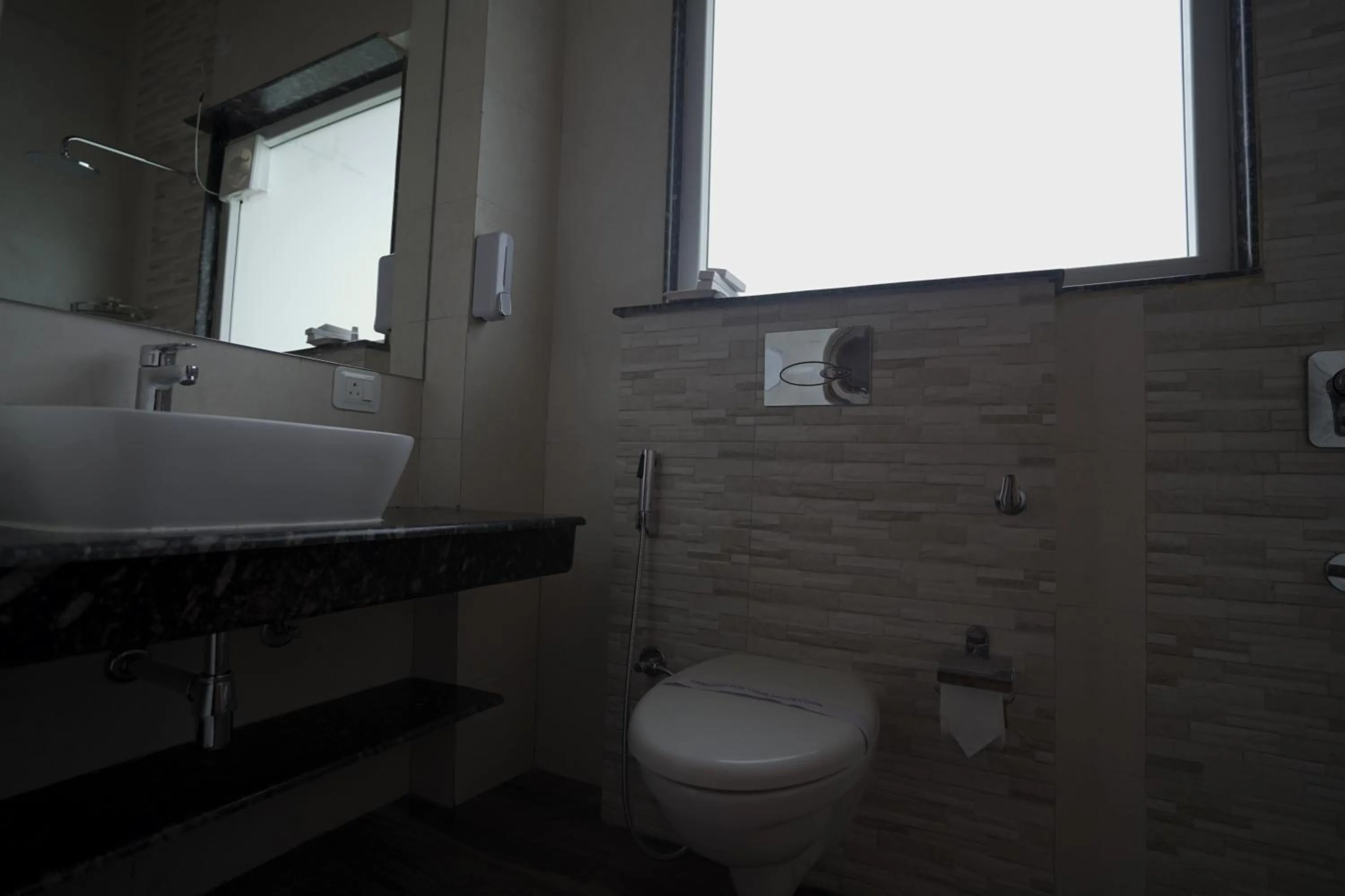 Toilet in NIVEDAN HOTEL AND RESORT