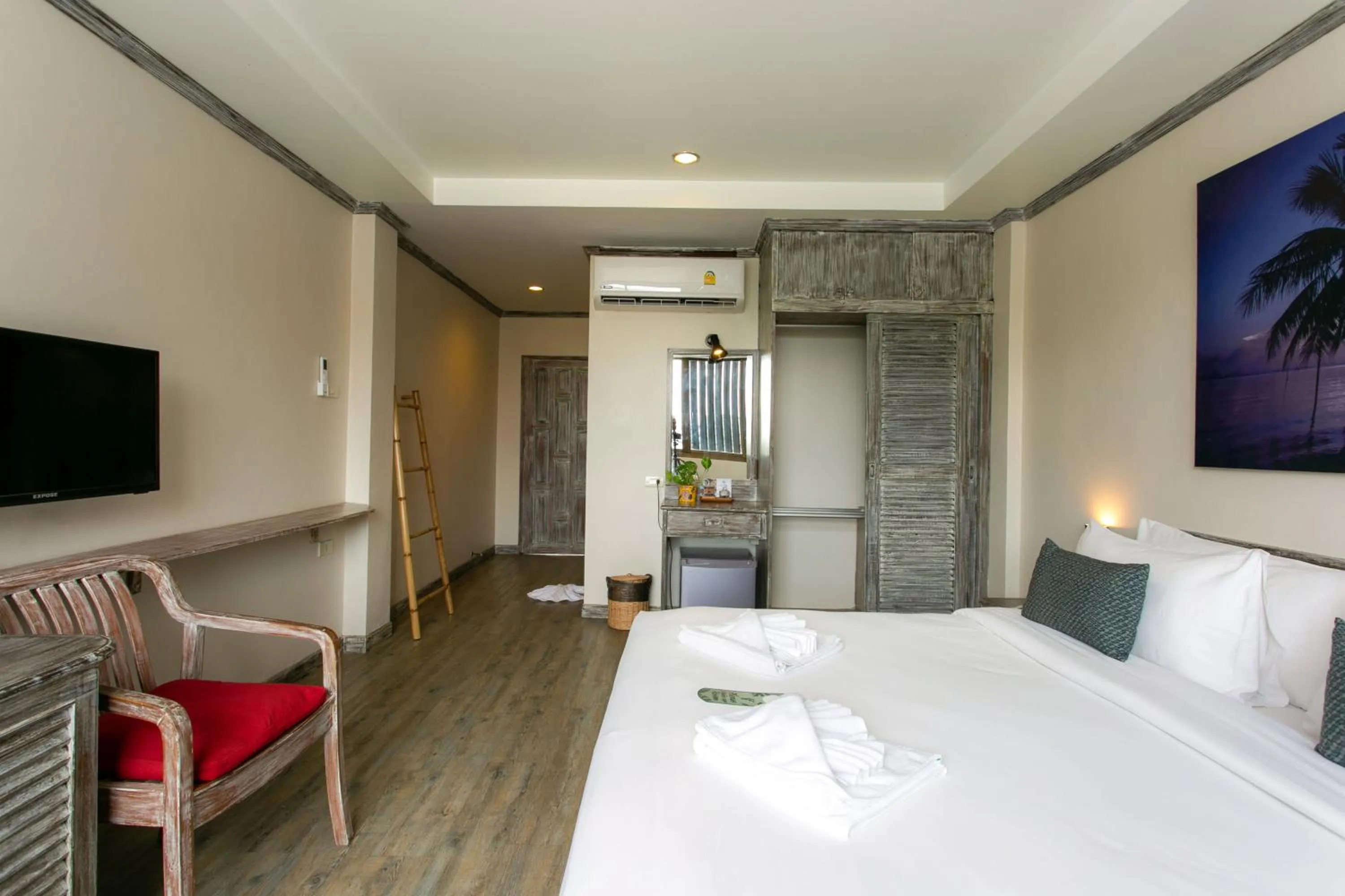 Bed in JALMIN Hotel Samui