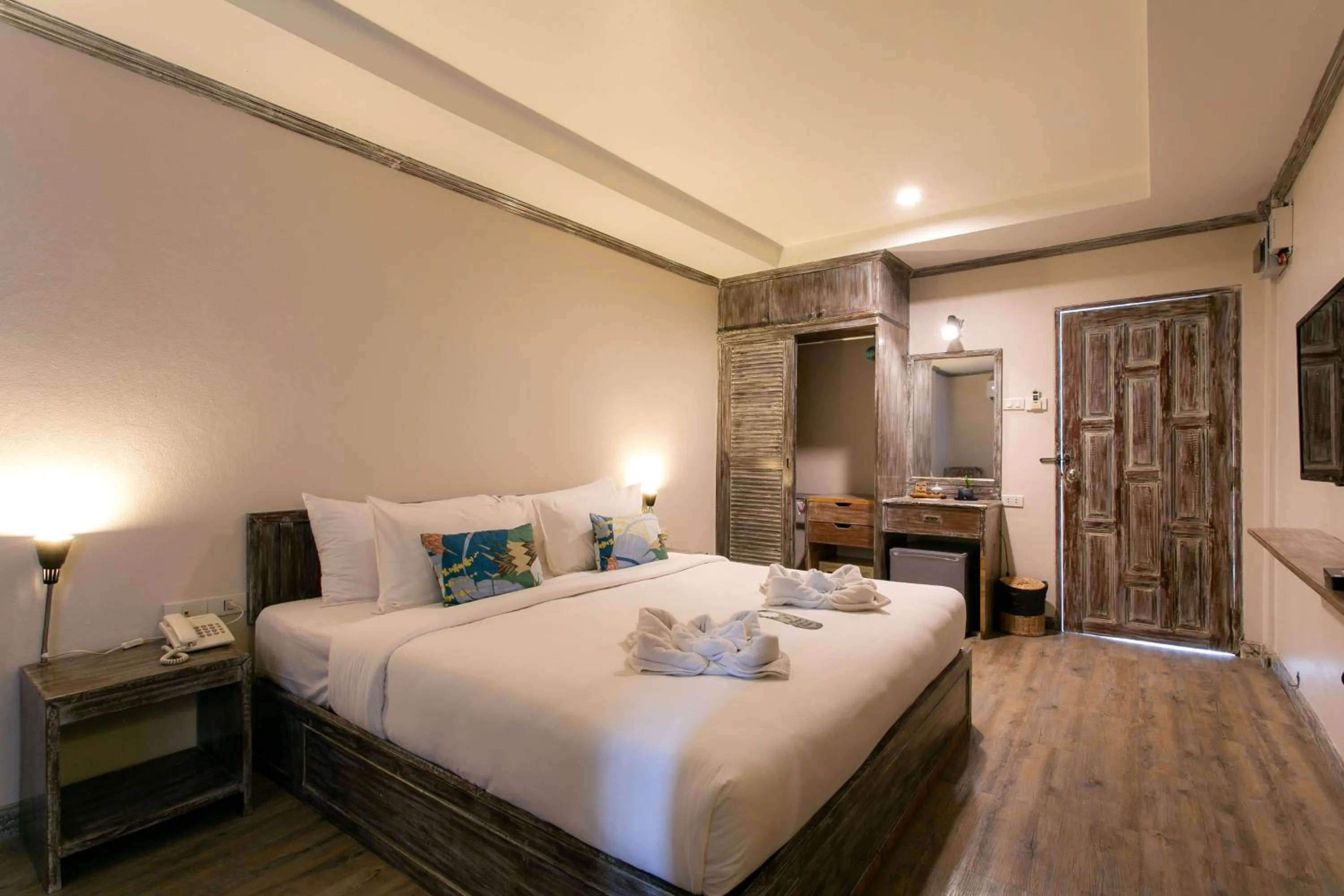 Bed in JALMIN Hotel Samui