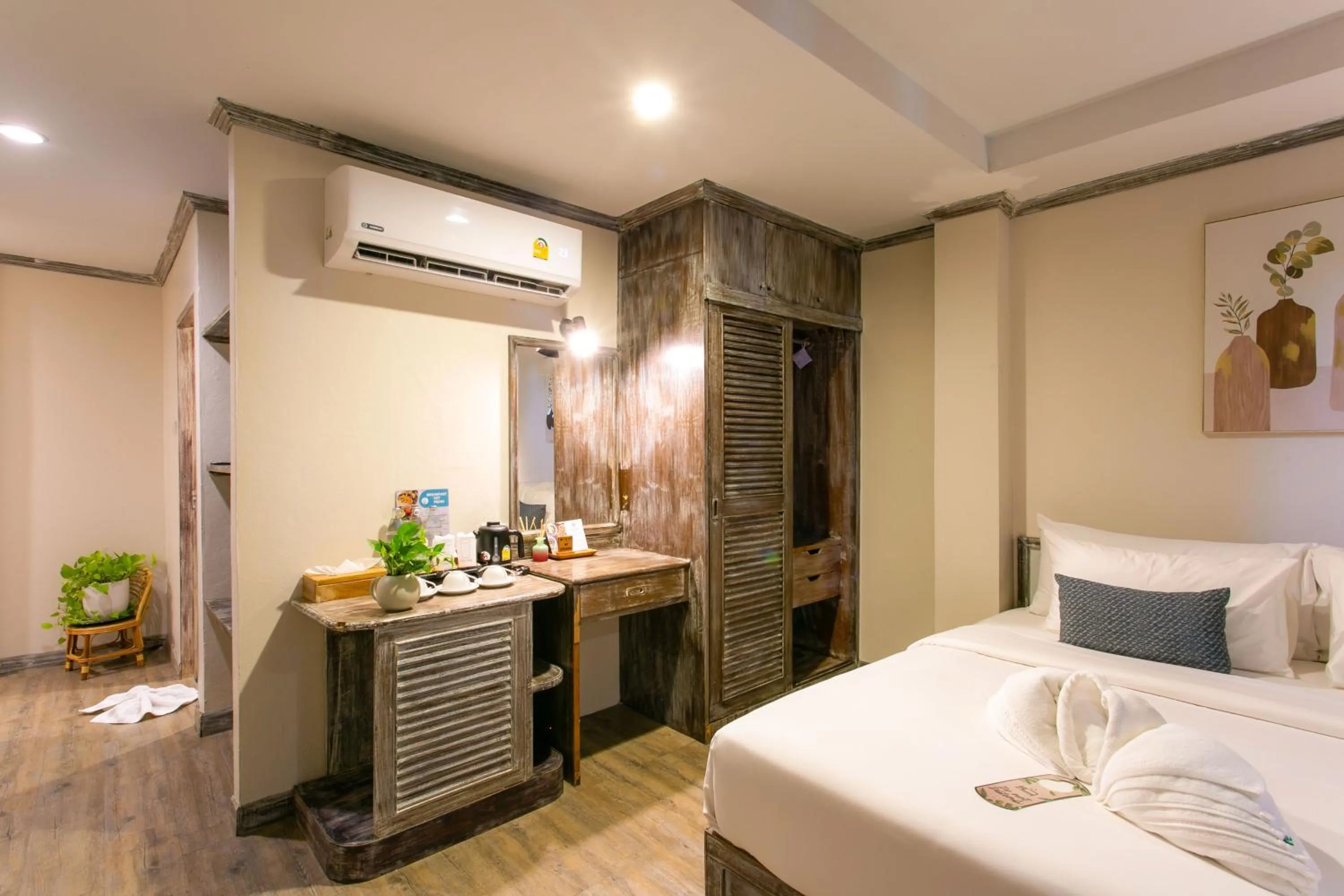 Bed in JALMIN Hotel Samui