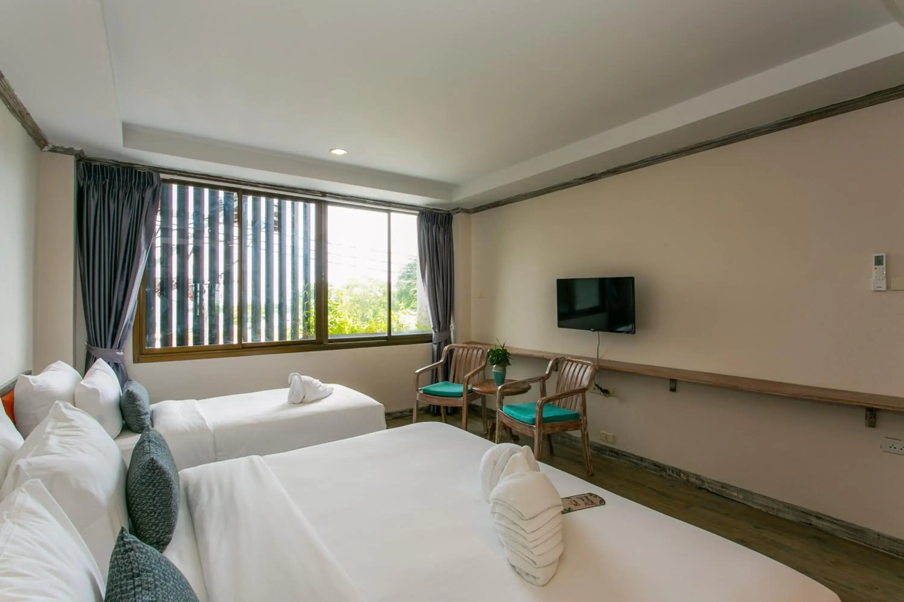 Bed in JALMIN Hotel Samui Bed in JALMIN Hotel Samui