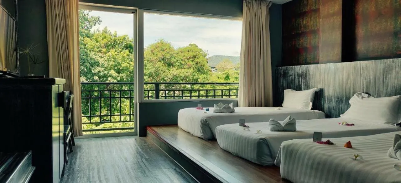 Bed in JALMIN Hotel Samui