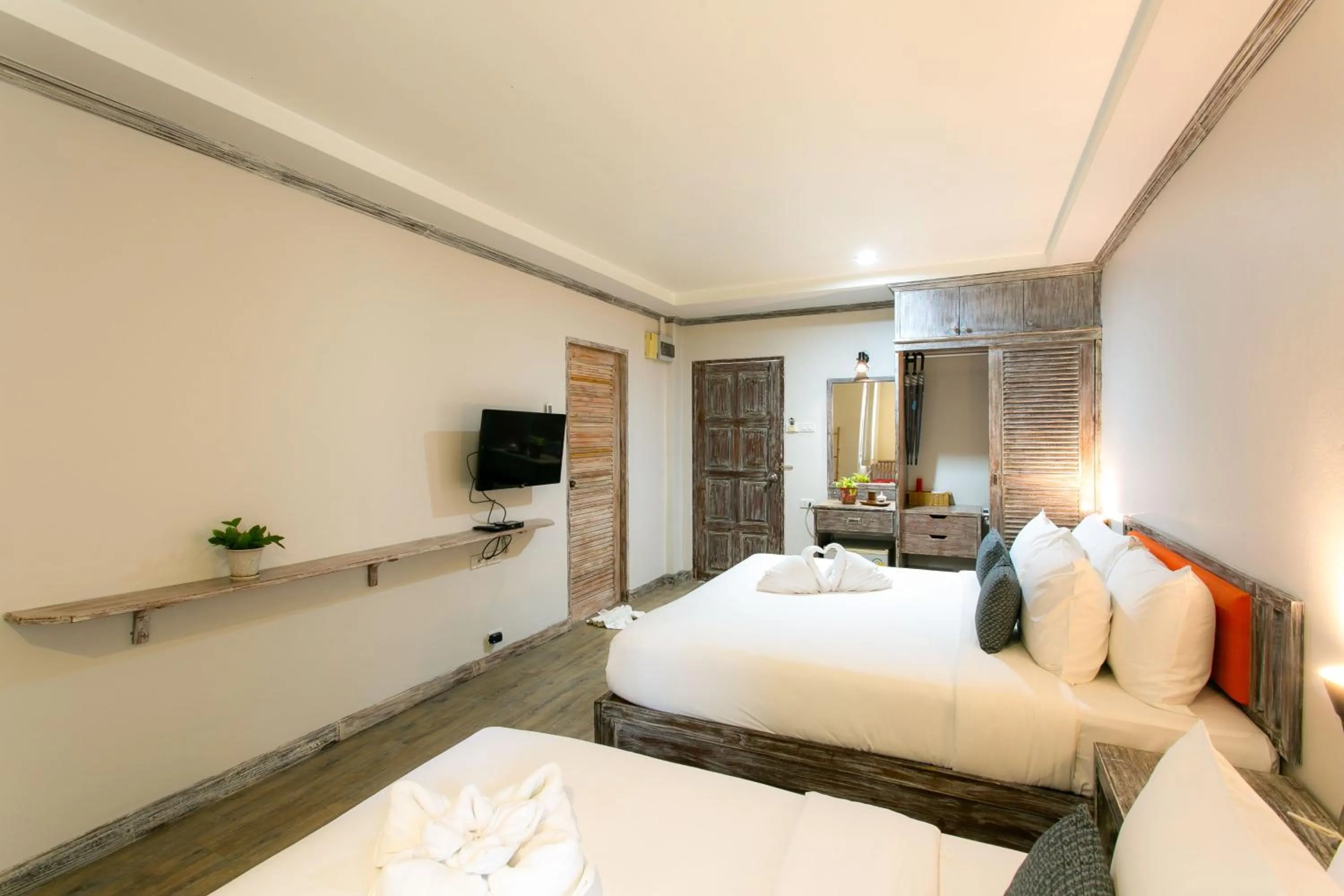 Bed in JALMIN Hotel Samui