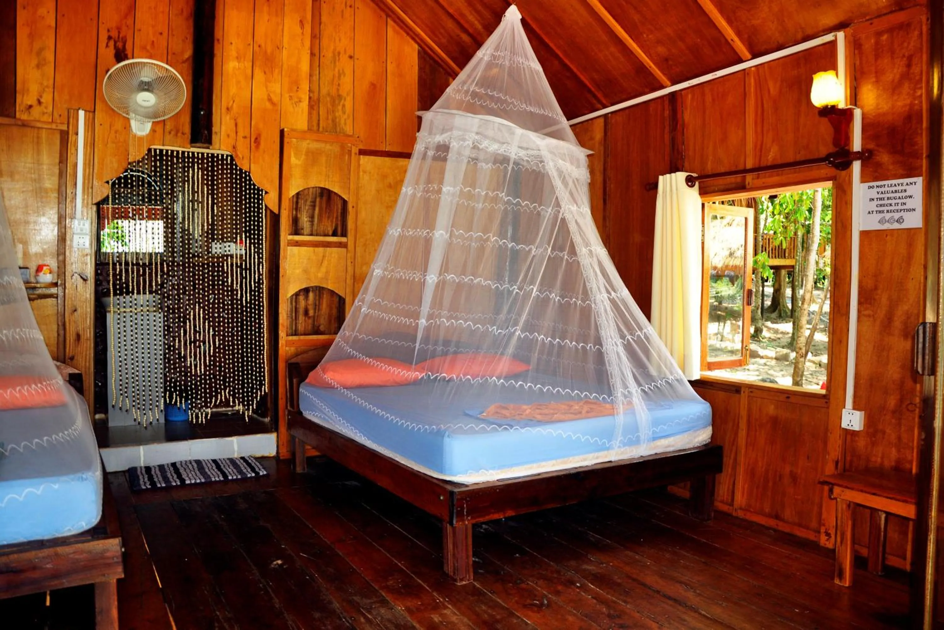 Bed in White Beach Bungalows