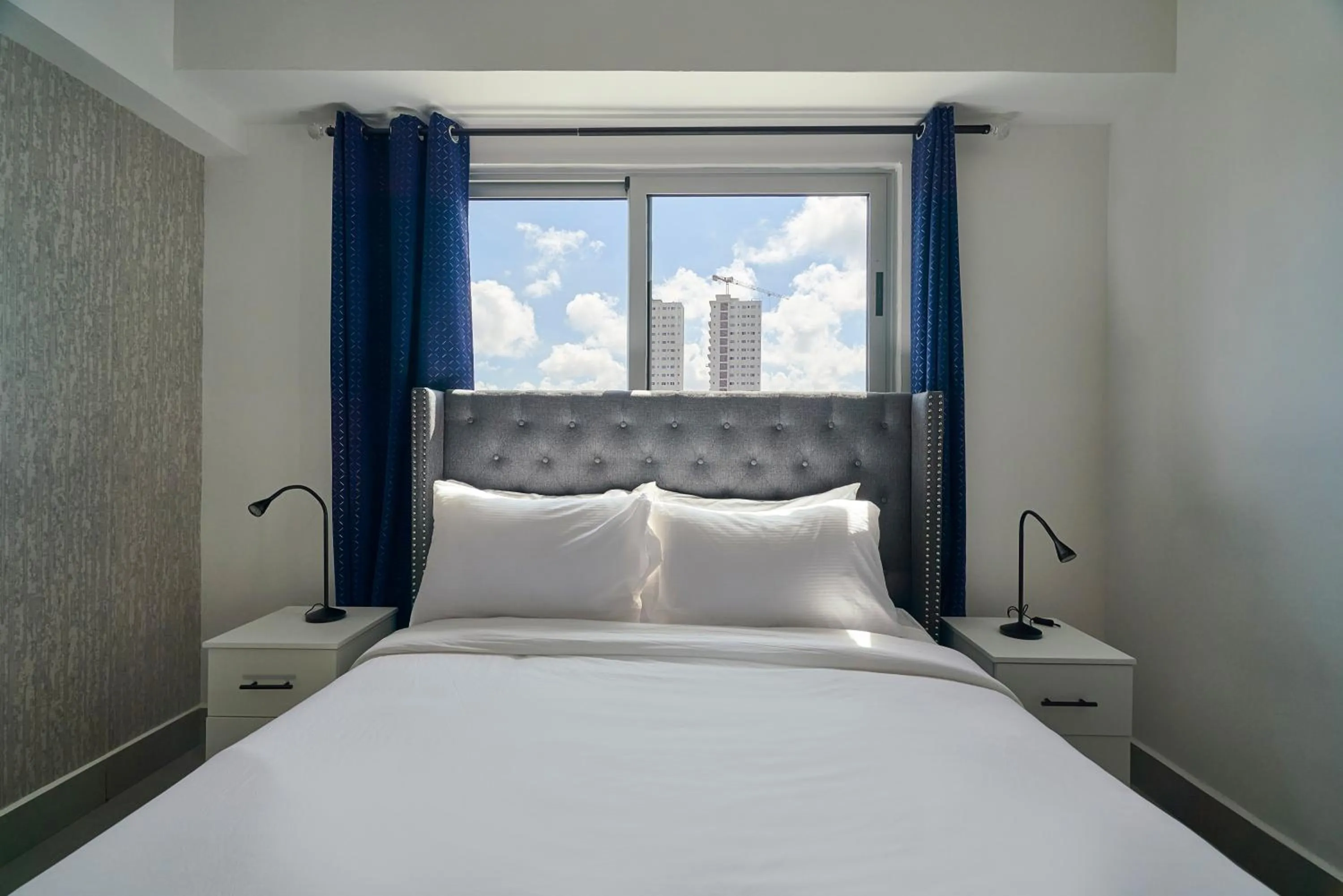 Bed in Central Suites Tower