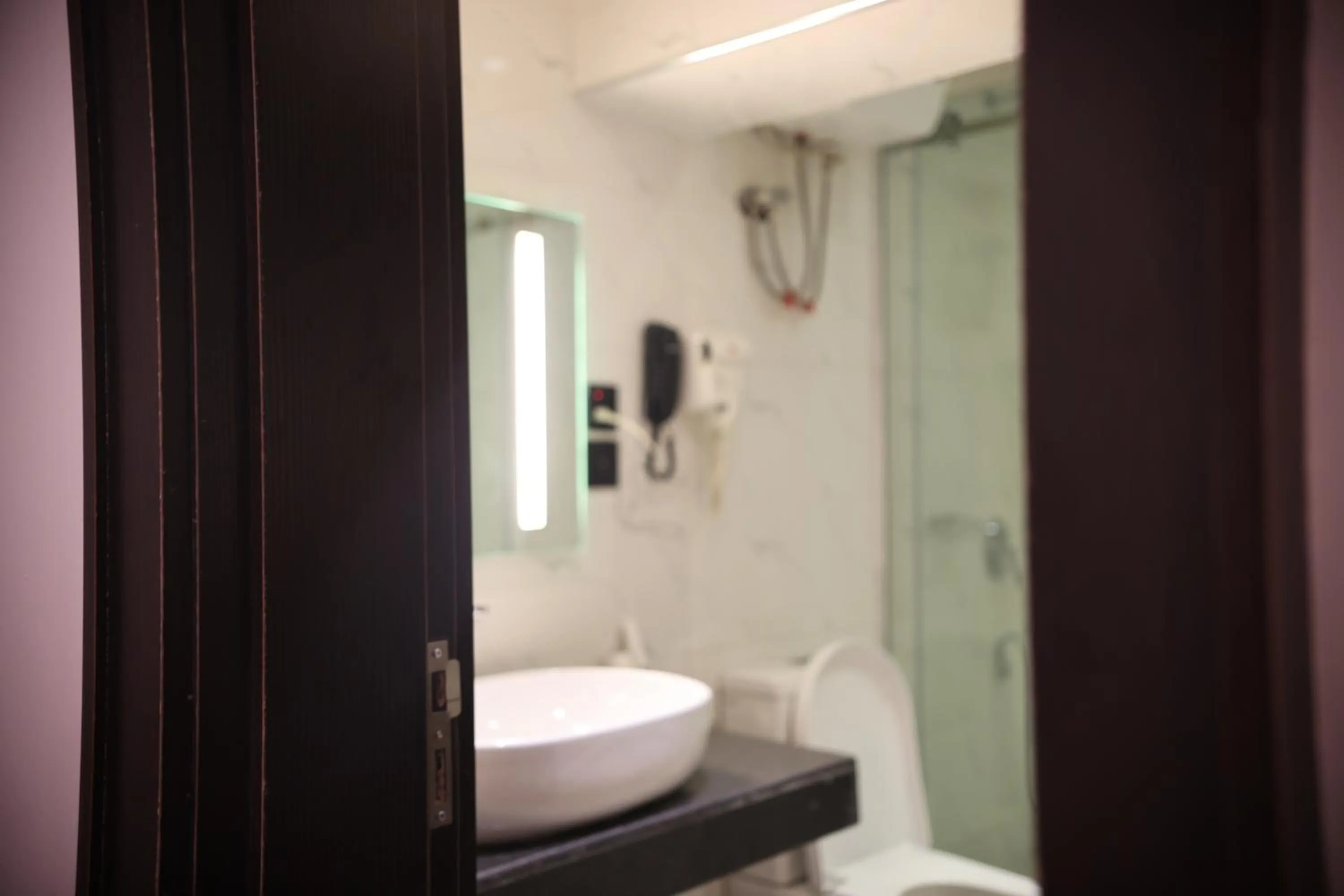 Shower in Bolton White Hotel - Abuja