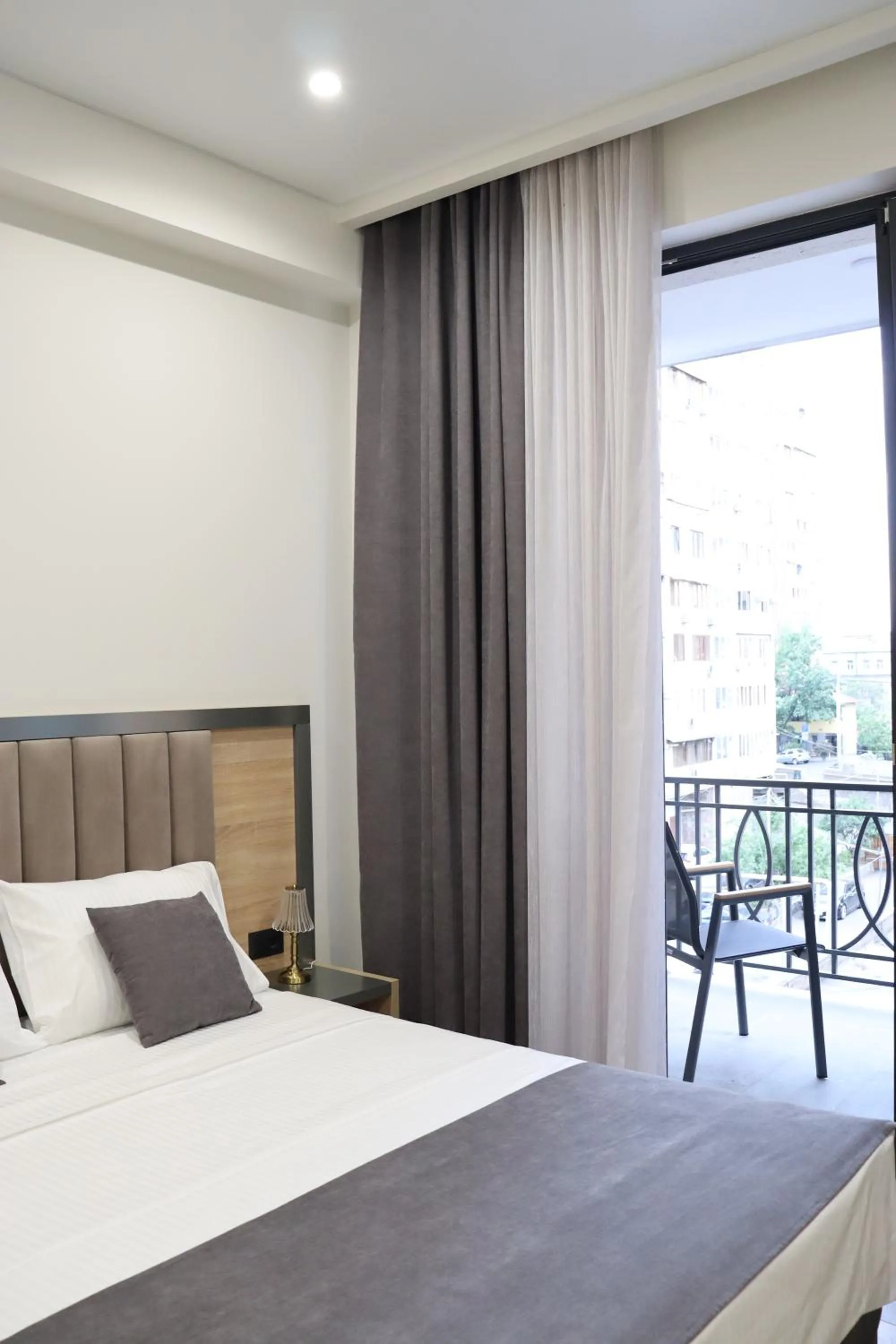 Bed in Orion ApartHotel