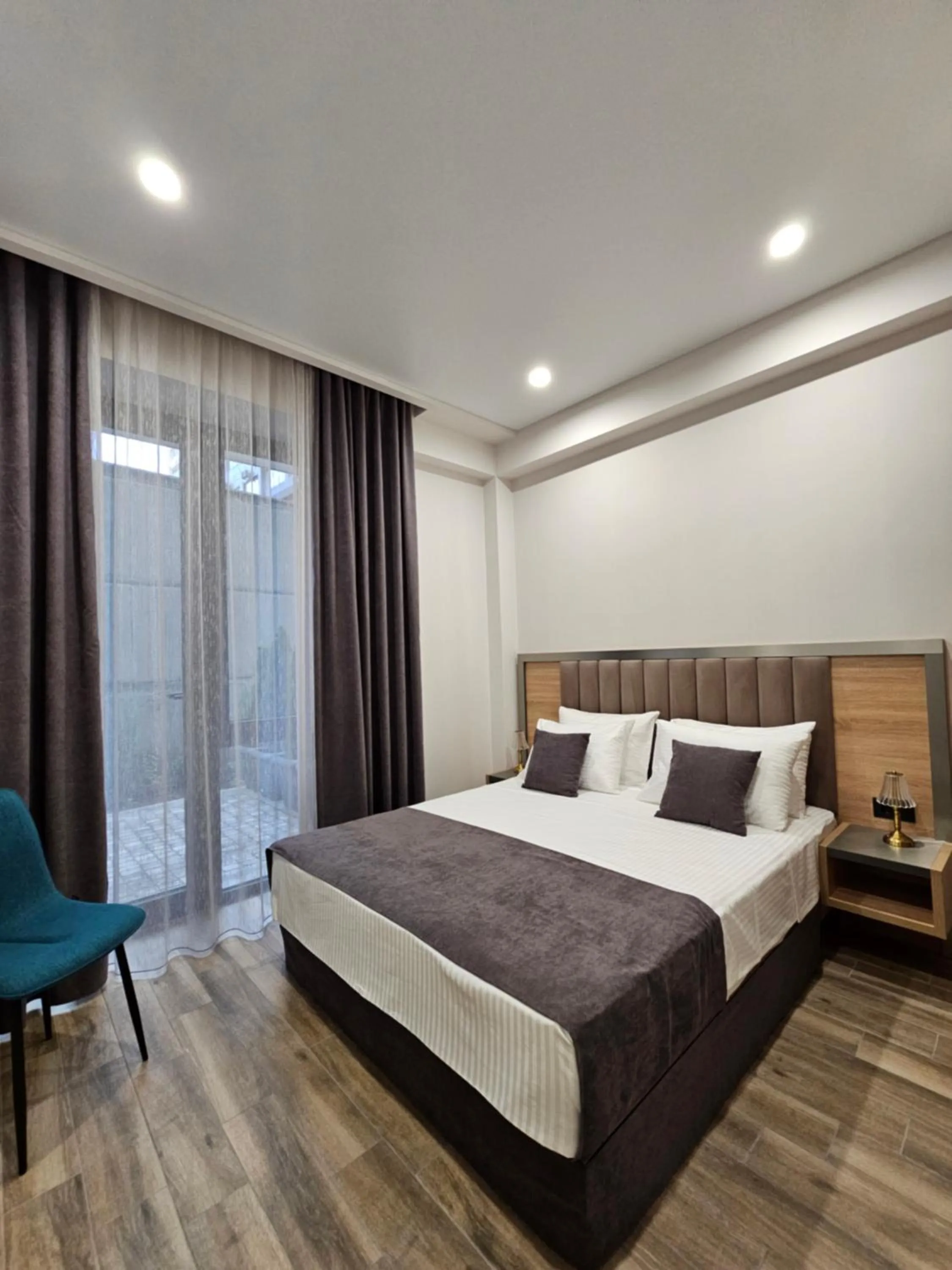 Bed in Orion ApartHotel