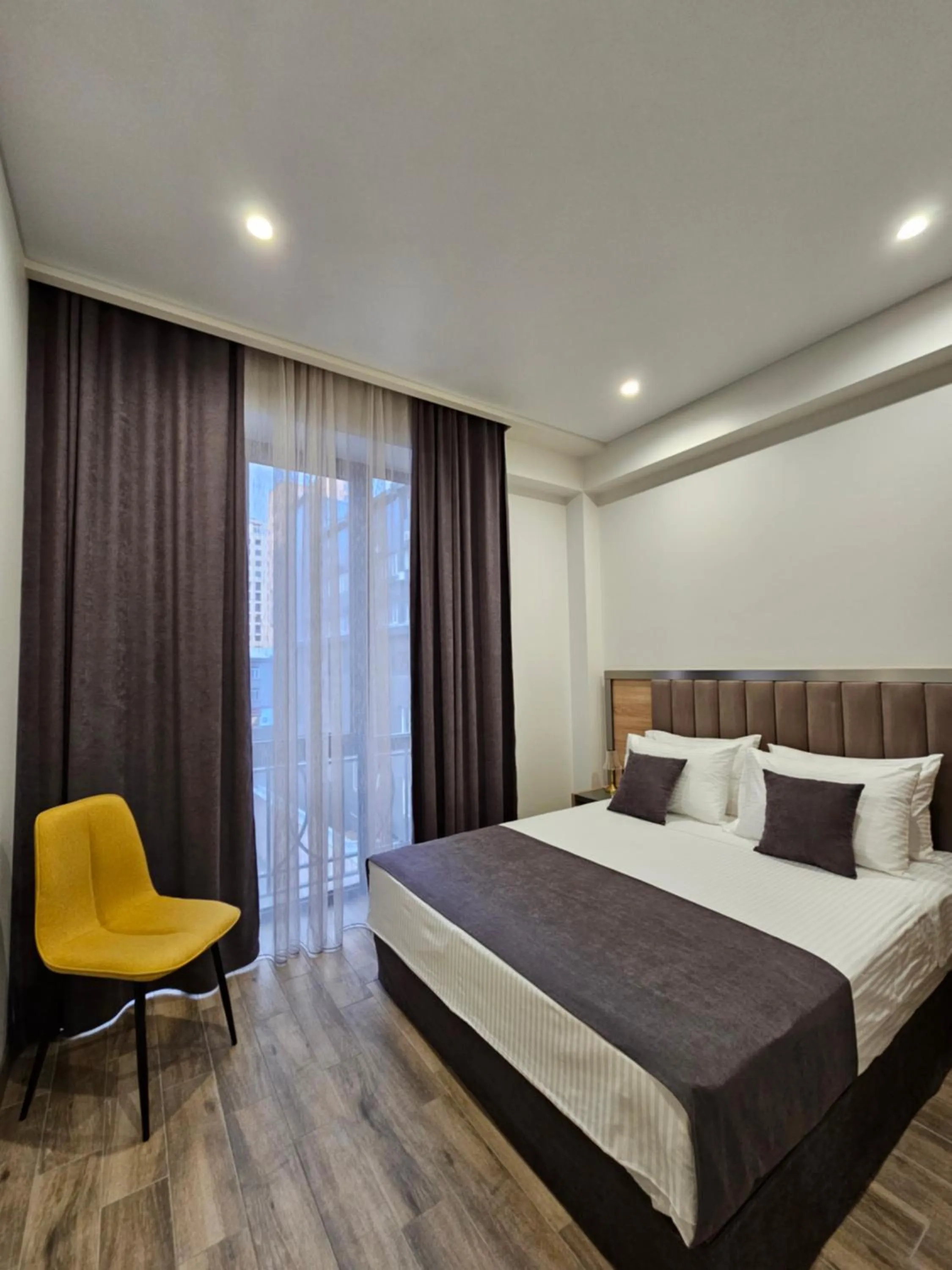 Bed in Orion ApartHotel