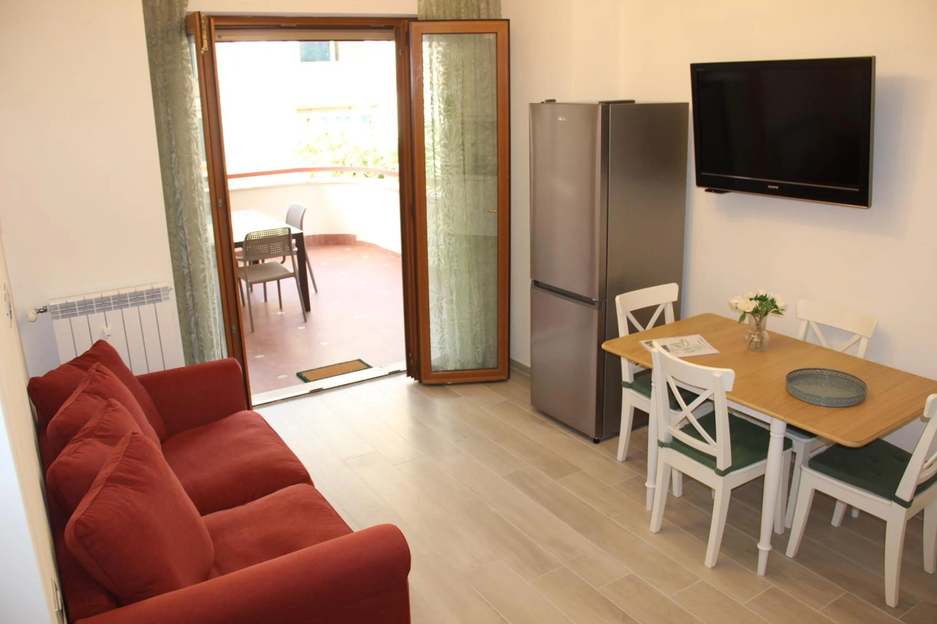 Communal lounge/ TV room in Appartamento Lungomare Toscanelli