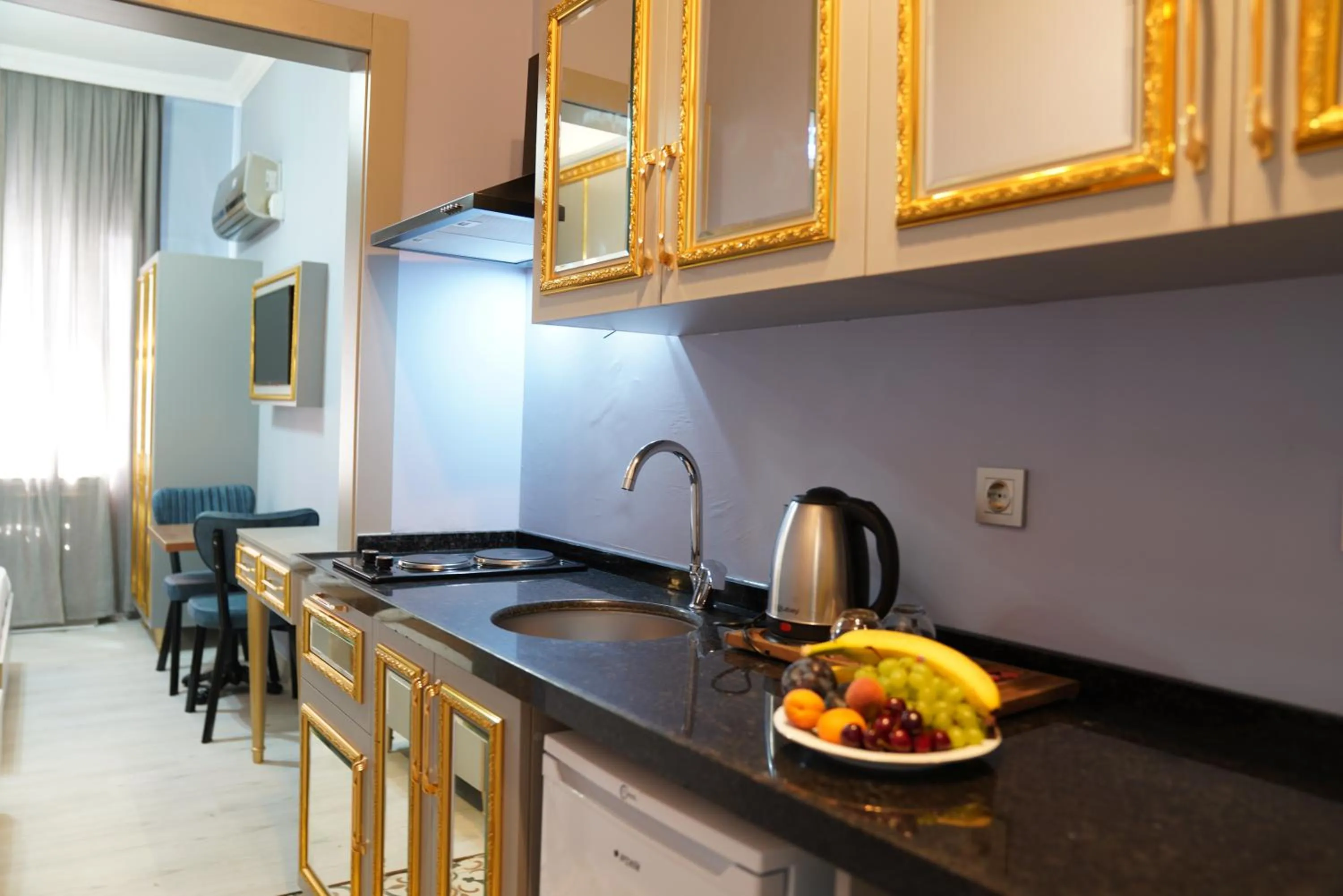 Kitchen or kitchenette in Taksim Maria suit hotel
