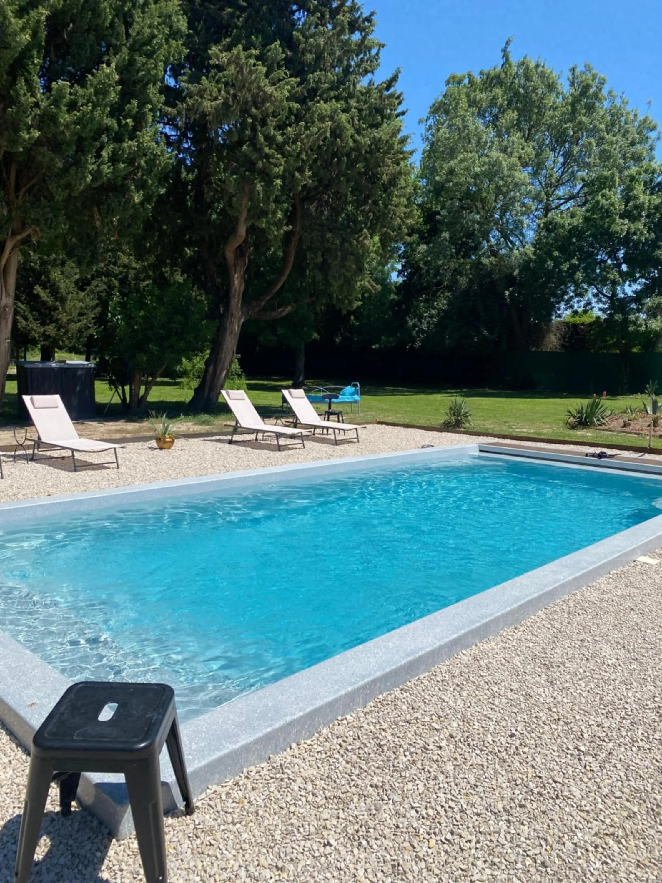 Swimming pool in Appartement Les Cyprès de l’Île