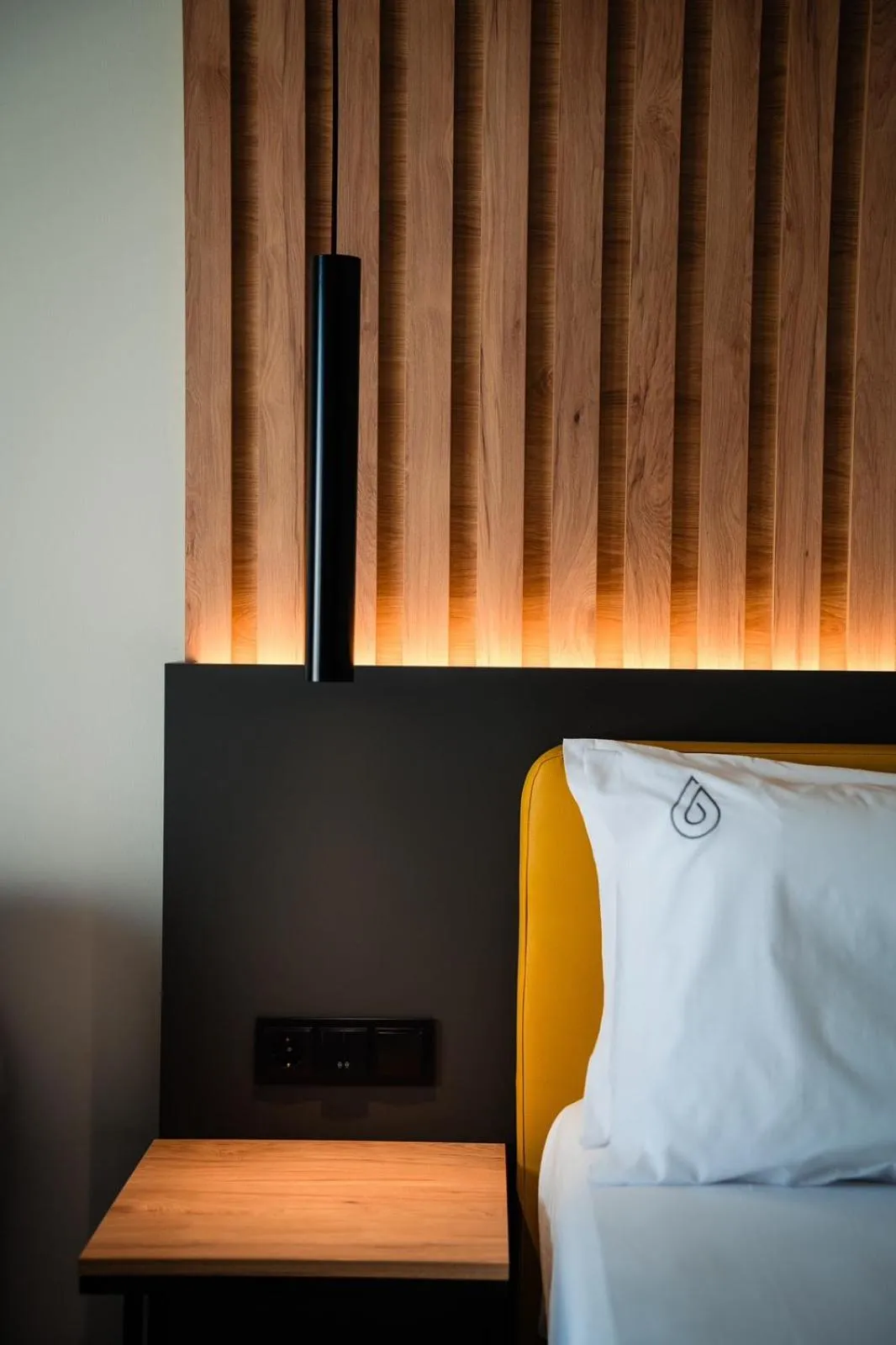 Bed in NERO SEASCAPE SUITES