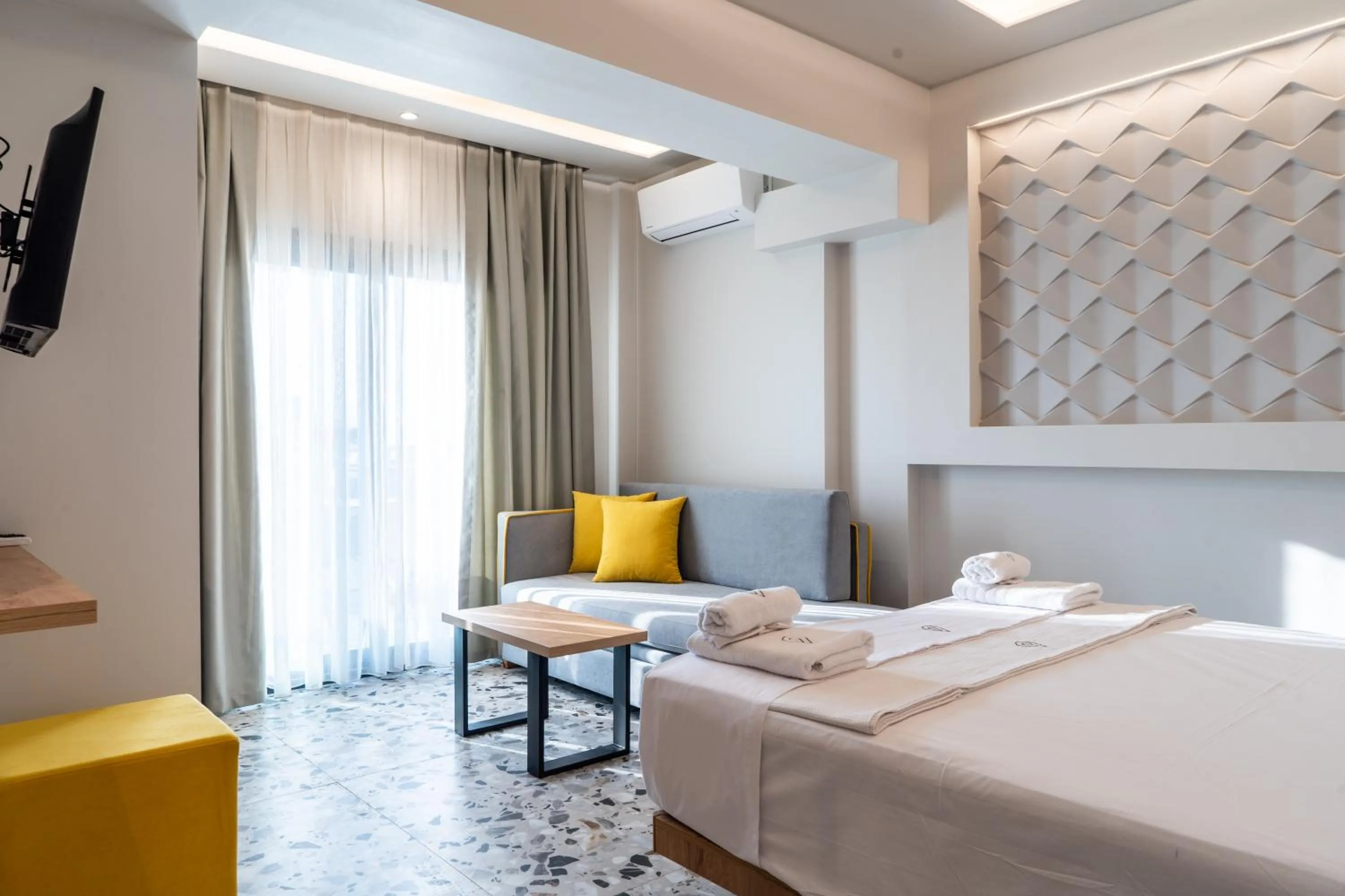 Bed in NERO SEASCAPE SUITES