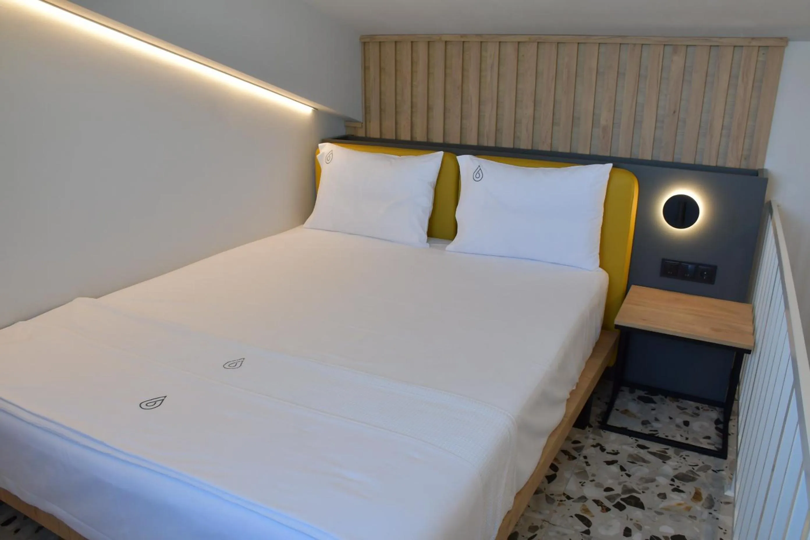 Bed in NERO SEASCAPE SUITES