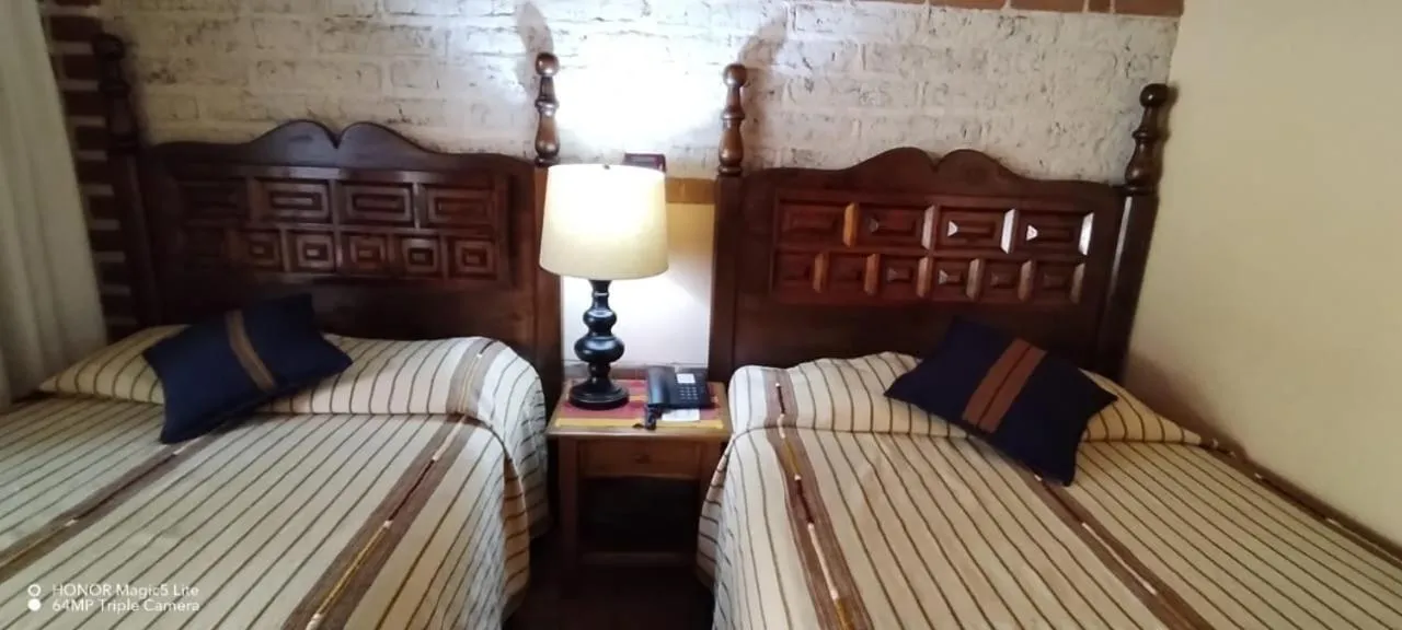 Bed in Hotel San Buenaventura de Atitlán