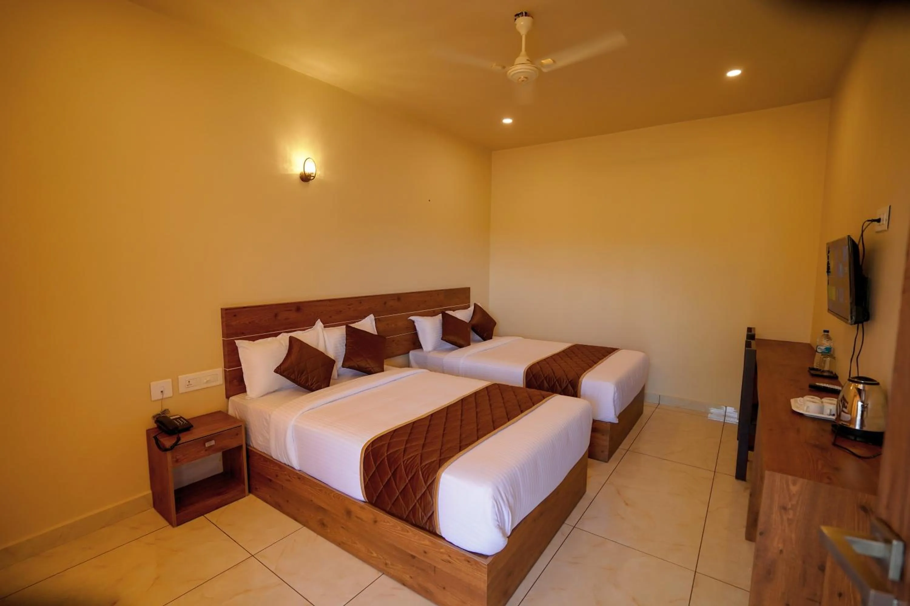 Bed in KOTTACKAL NATURE INN