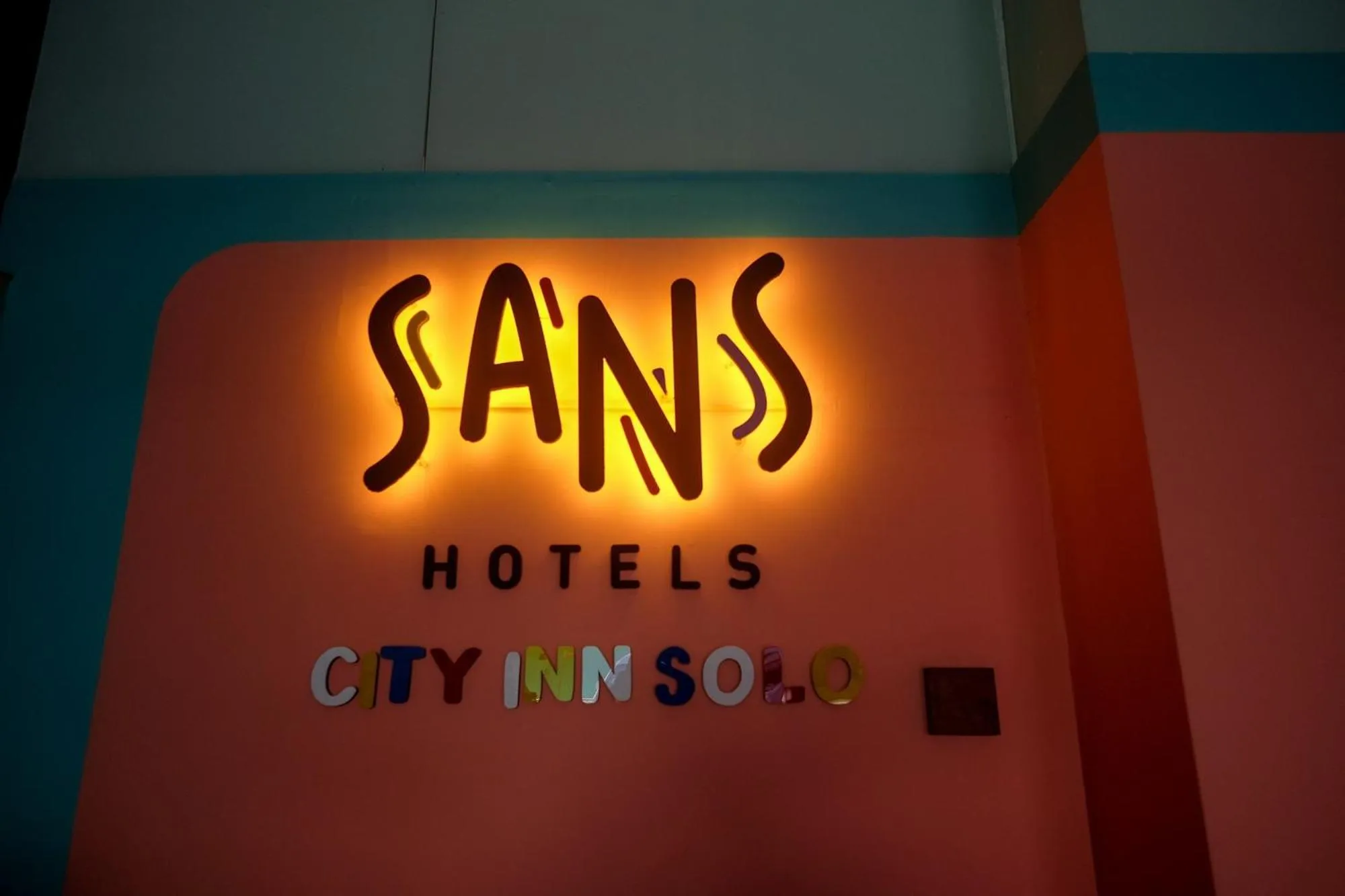Property logo or sign in Sans Hotel City Inn Solo by RedDoorz
