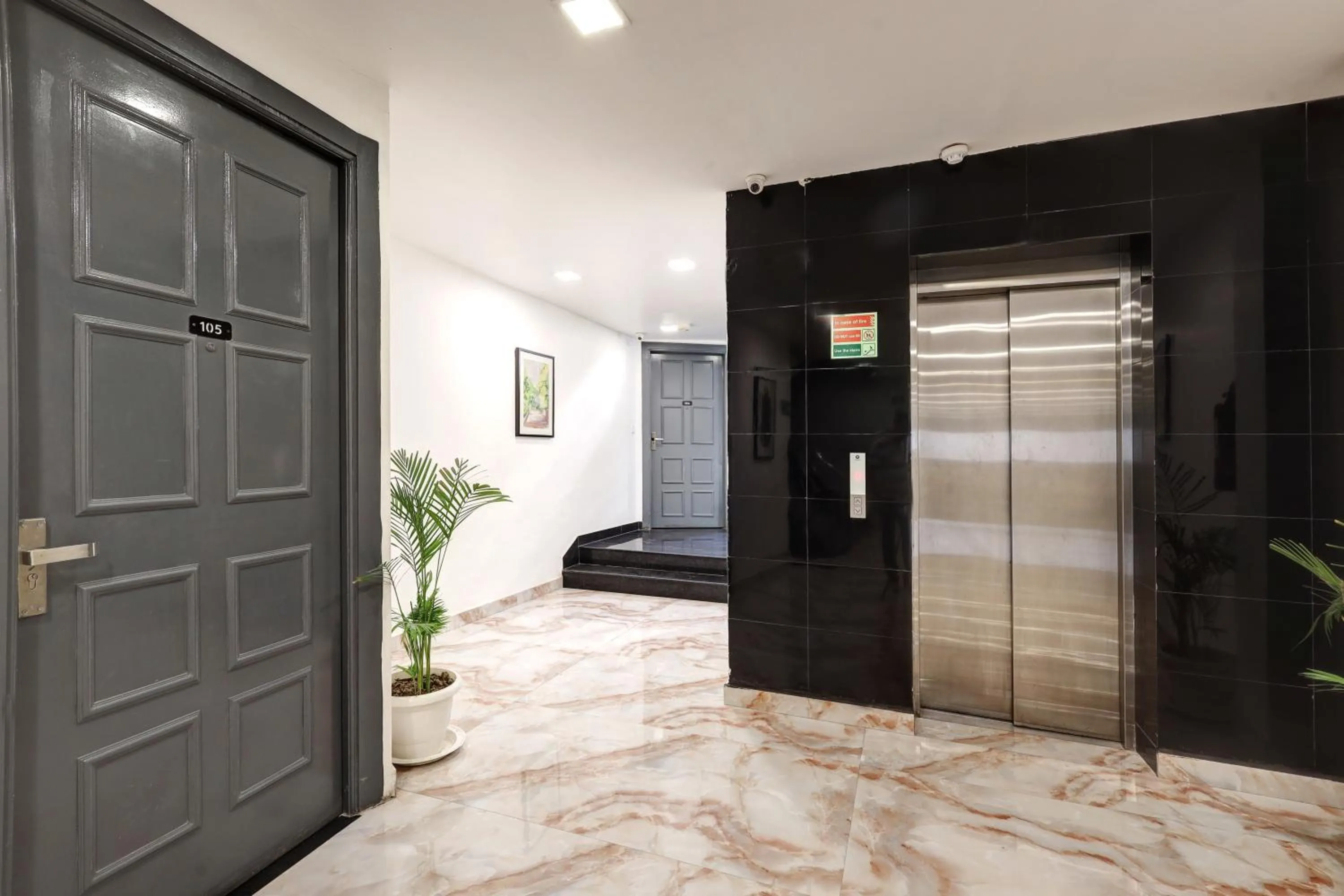 elevator in Hotel The Rasa Near Welcome Metro Station