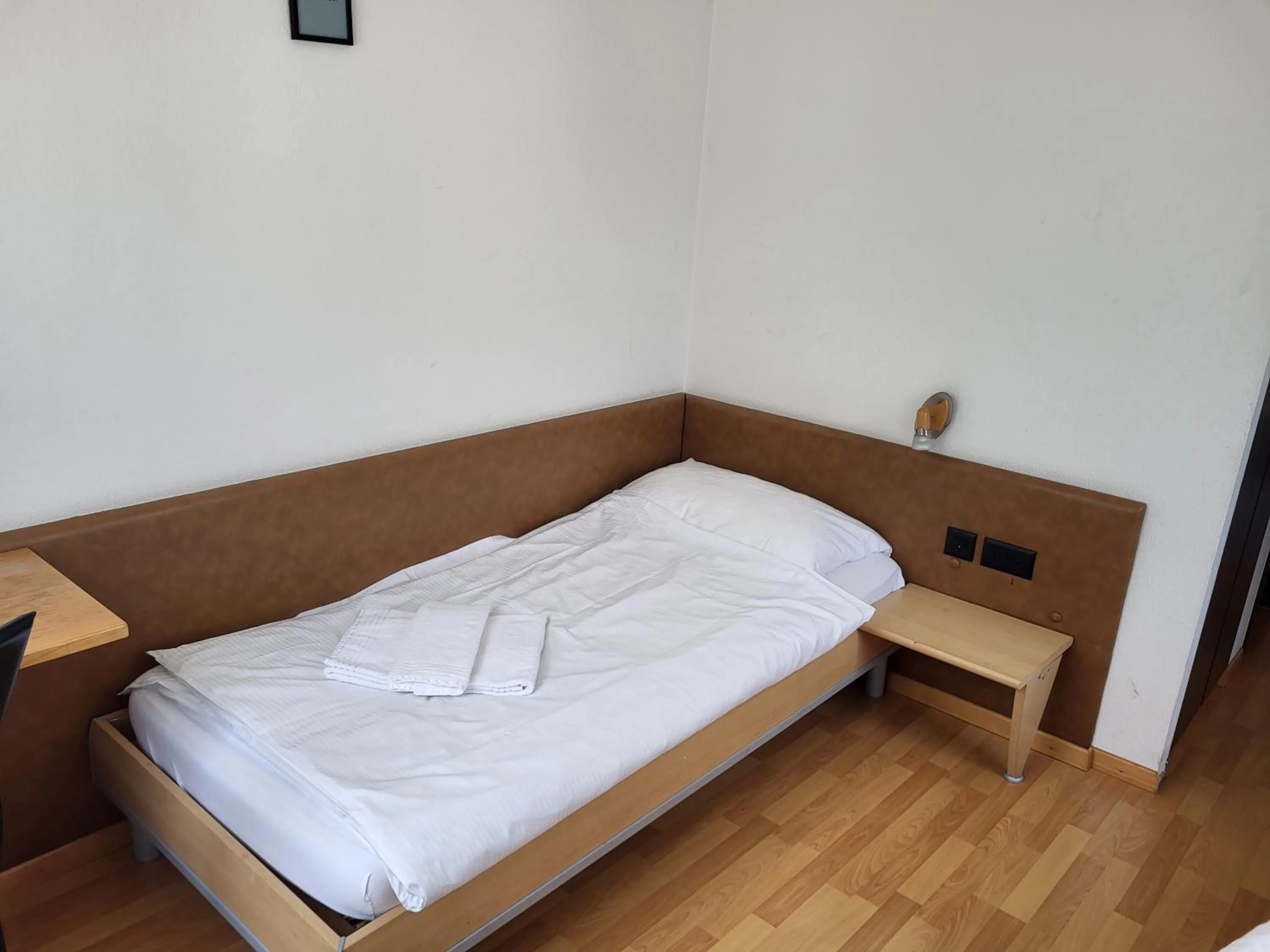 Bed in Hotel Stadthof Glarus