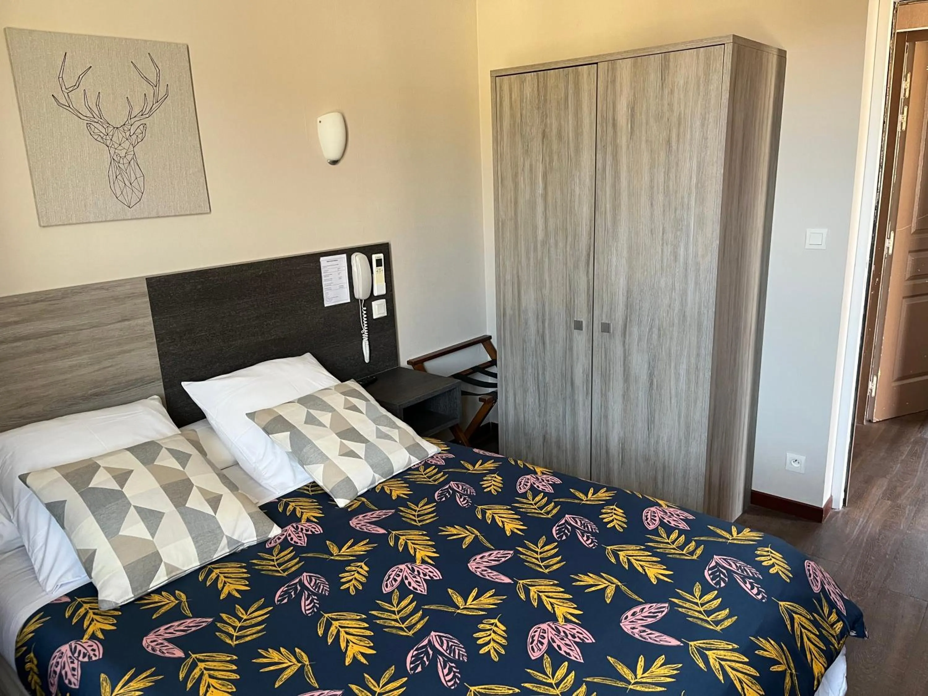 Bed in HOTEL LES MARRONNIERS