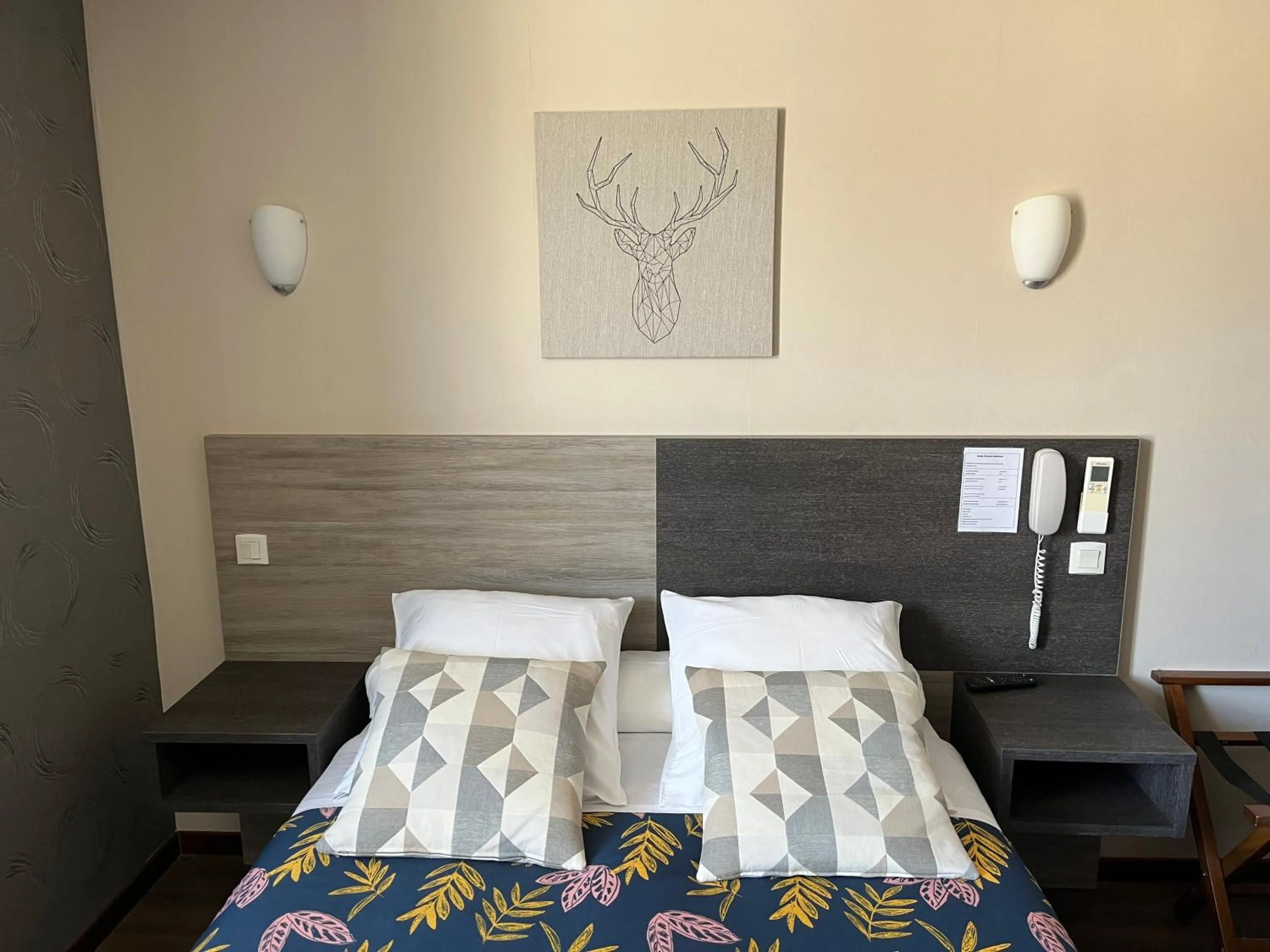 Bed in HOTEL LES MARRONNIERS