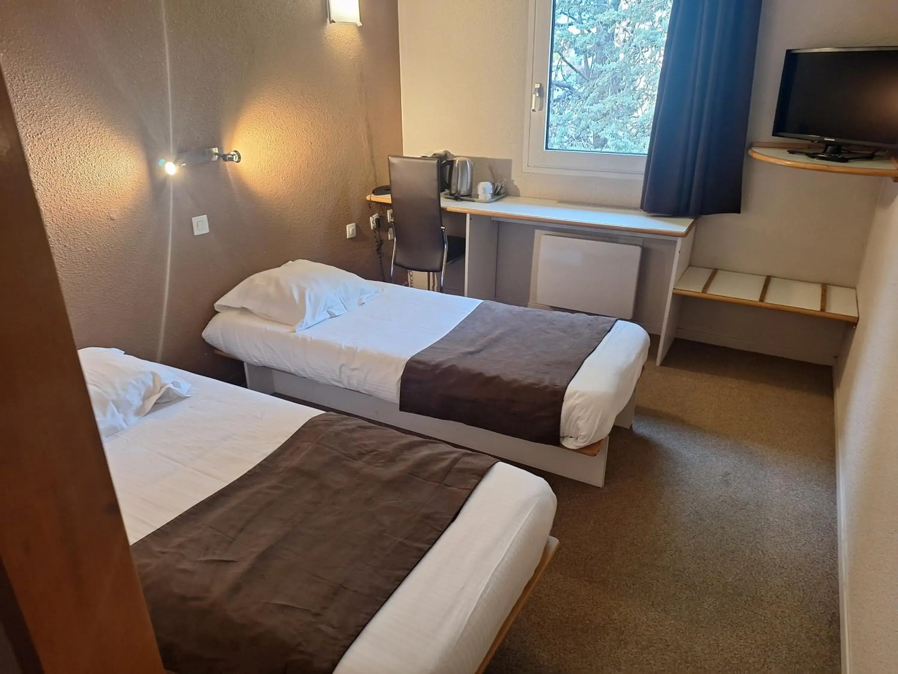 Photo of the whole room, Bed in Hotel du Moulin à Vent - Gerland Photo of the whole room, Bed in Hotel du Moulin à Vent - Gerland