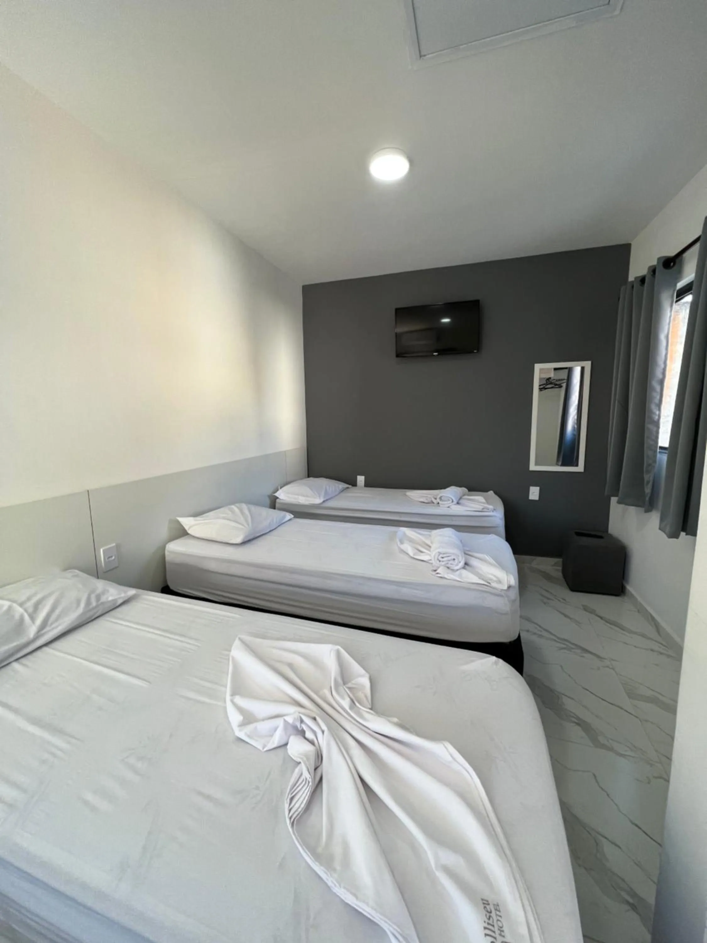 Bed in Hotel Pousada Colliseu