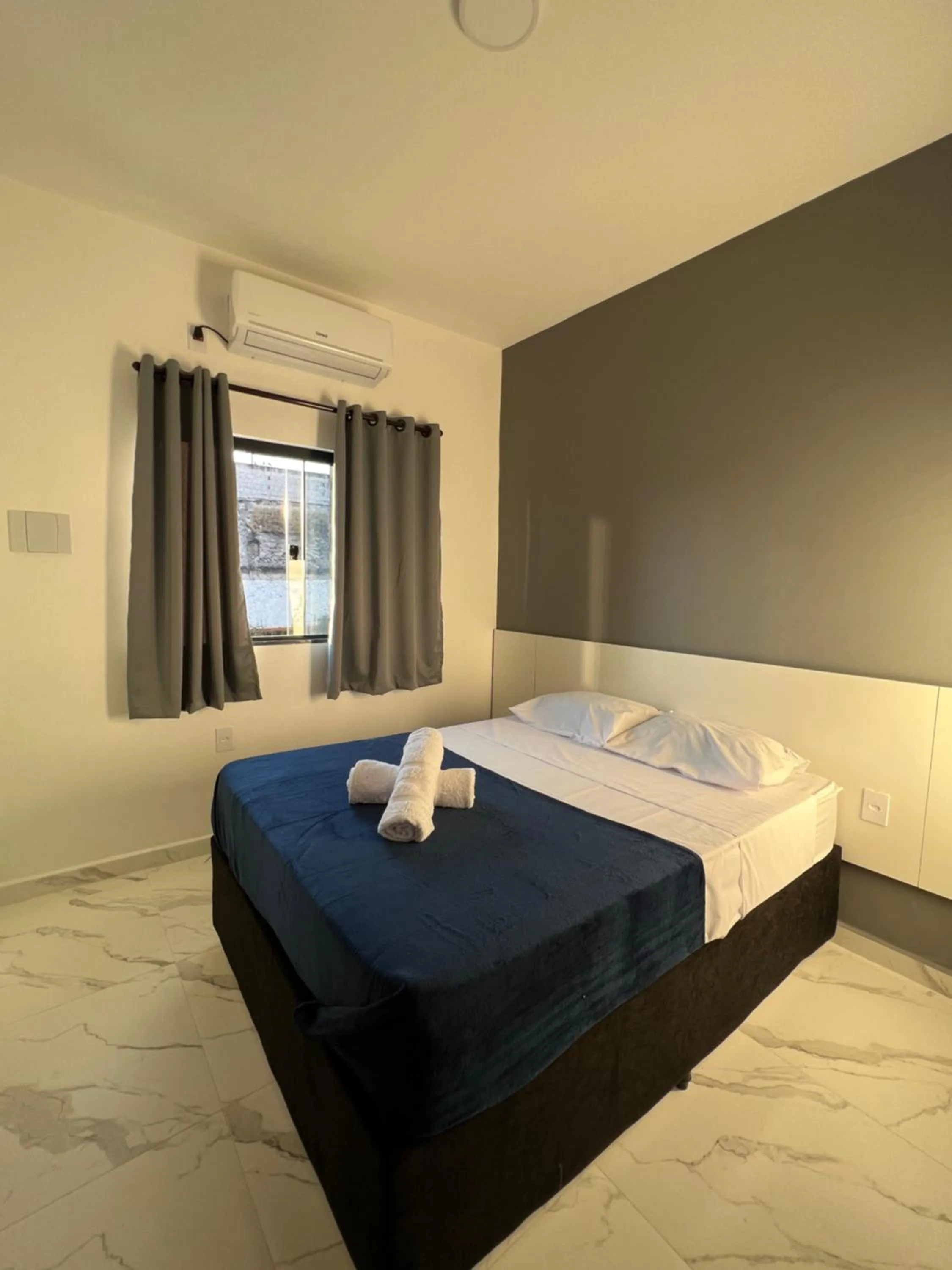 Bed in Hotel Pousada Colliseu