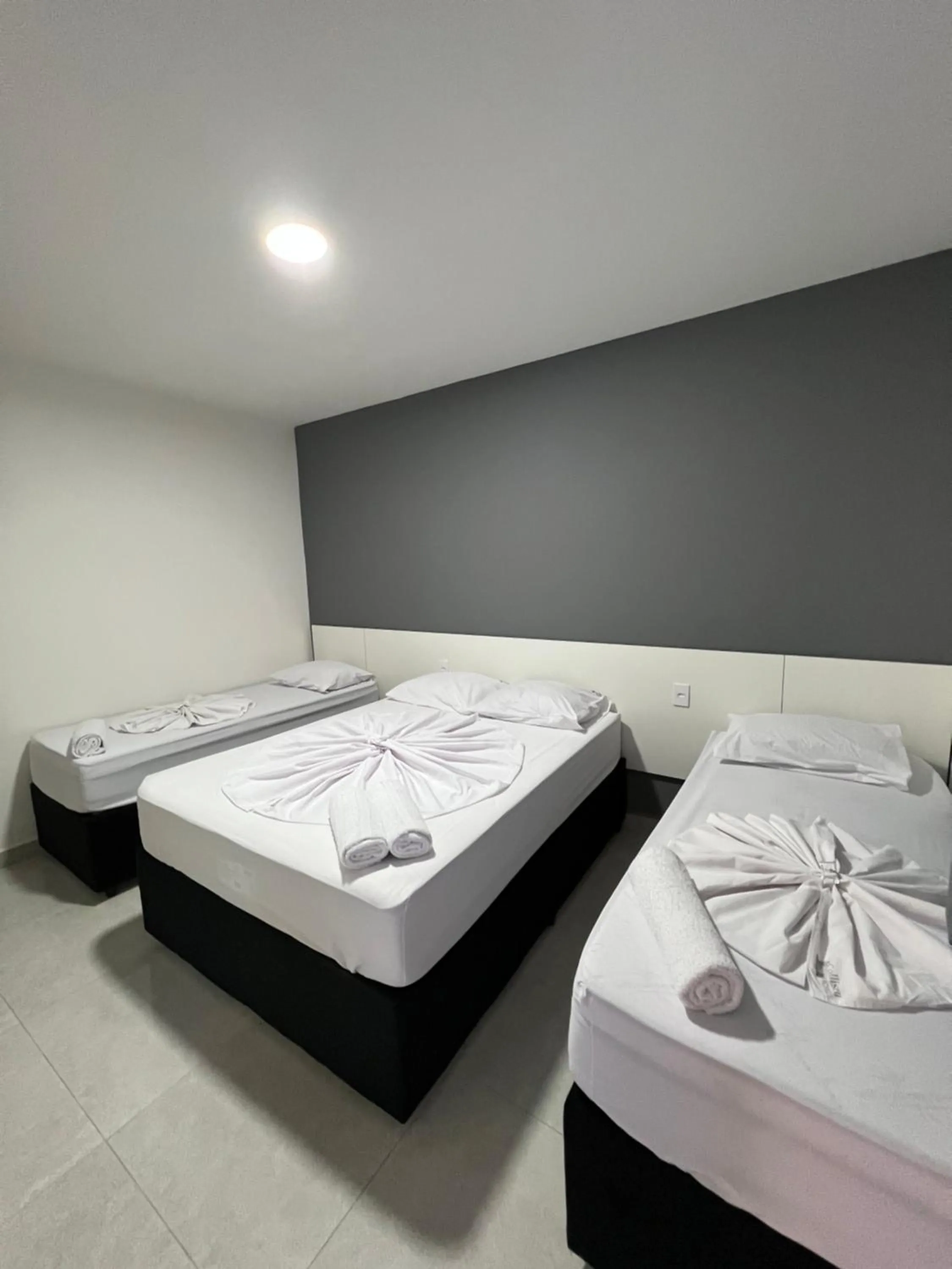 Bed in Hotel Pousada Colliseu