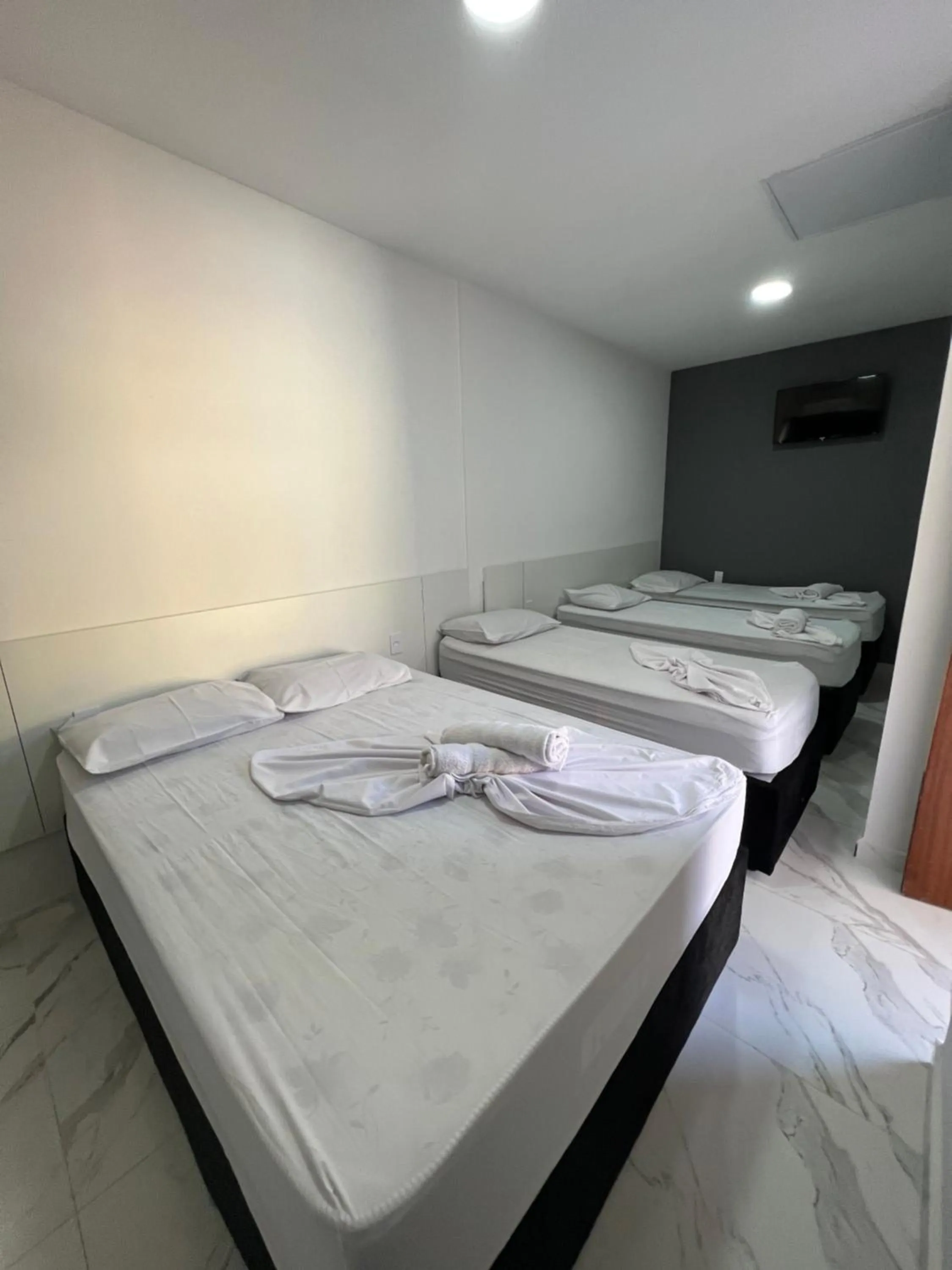 Bed in Hotel Pousada Colliseu