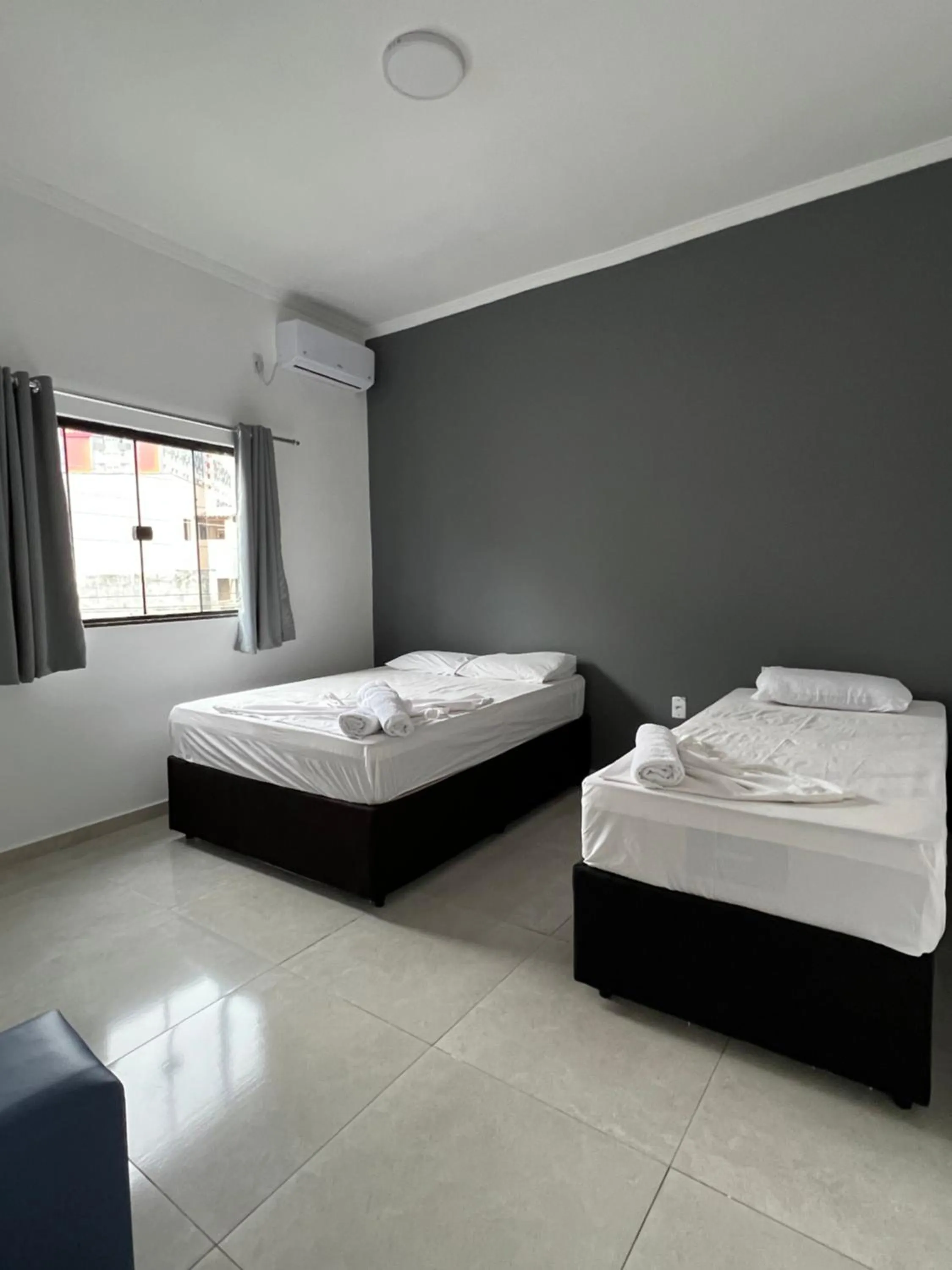 Bed in Hotel Pousada Colliseu