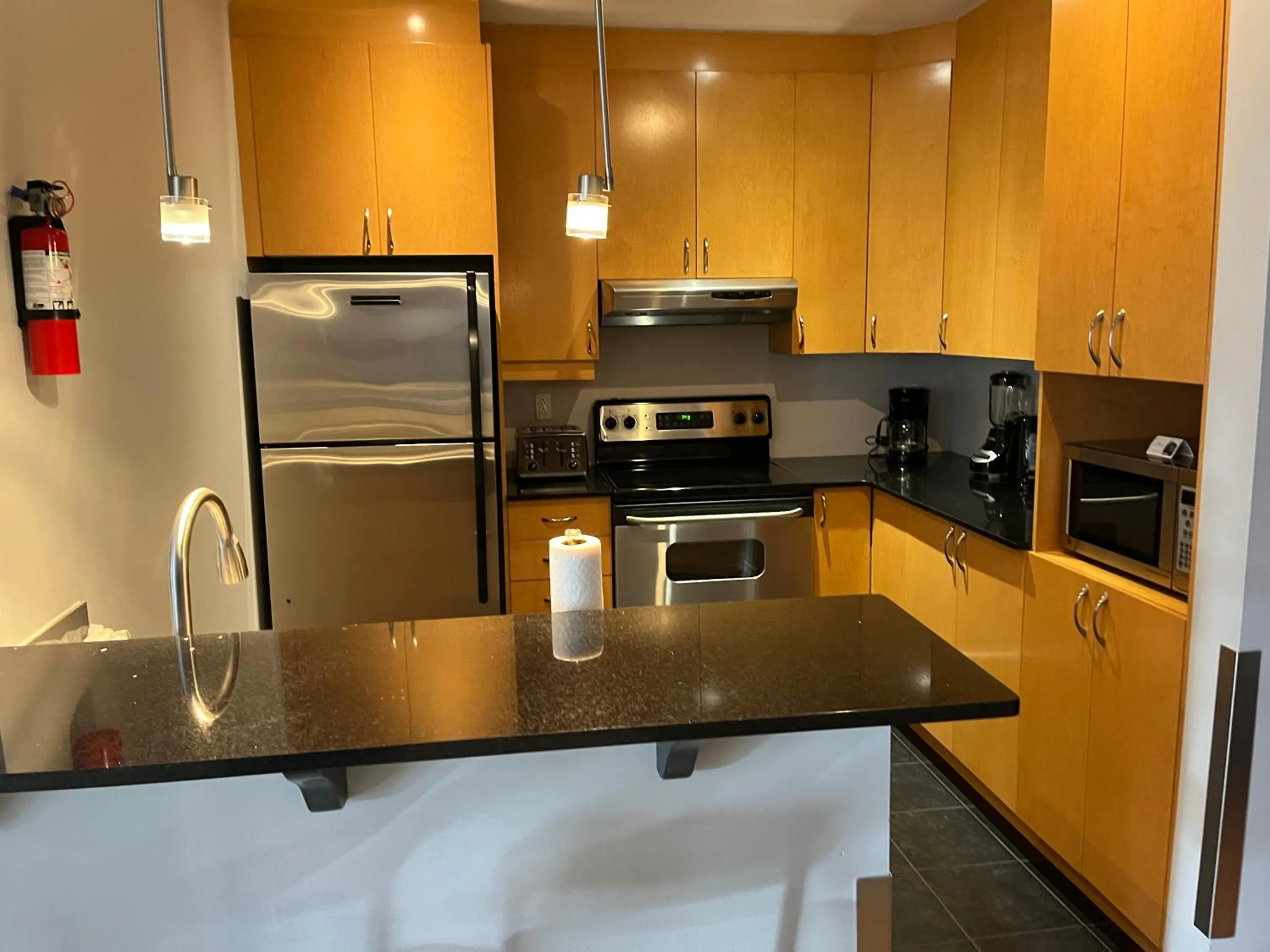 kitchen in ApartHotelMontreal by Les Terrasses Saint Urbain 2225I2