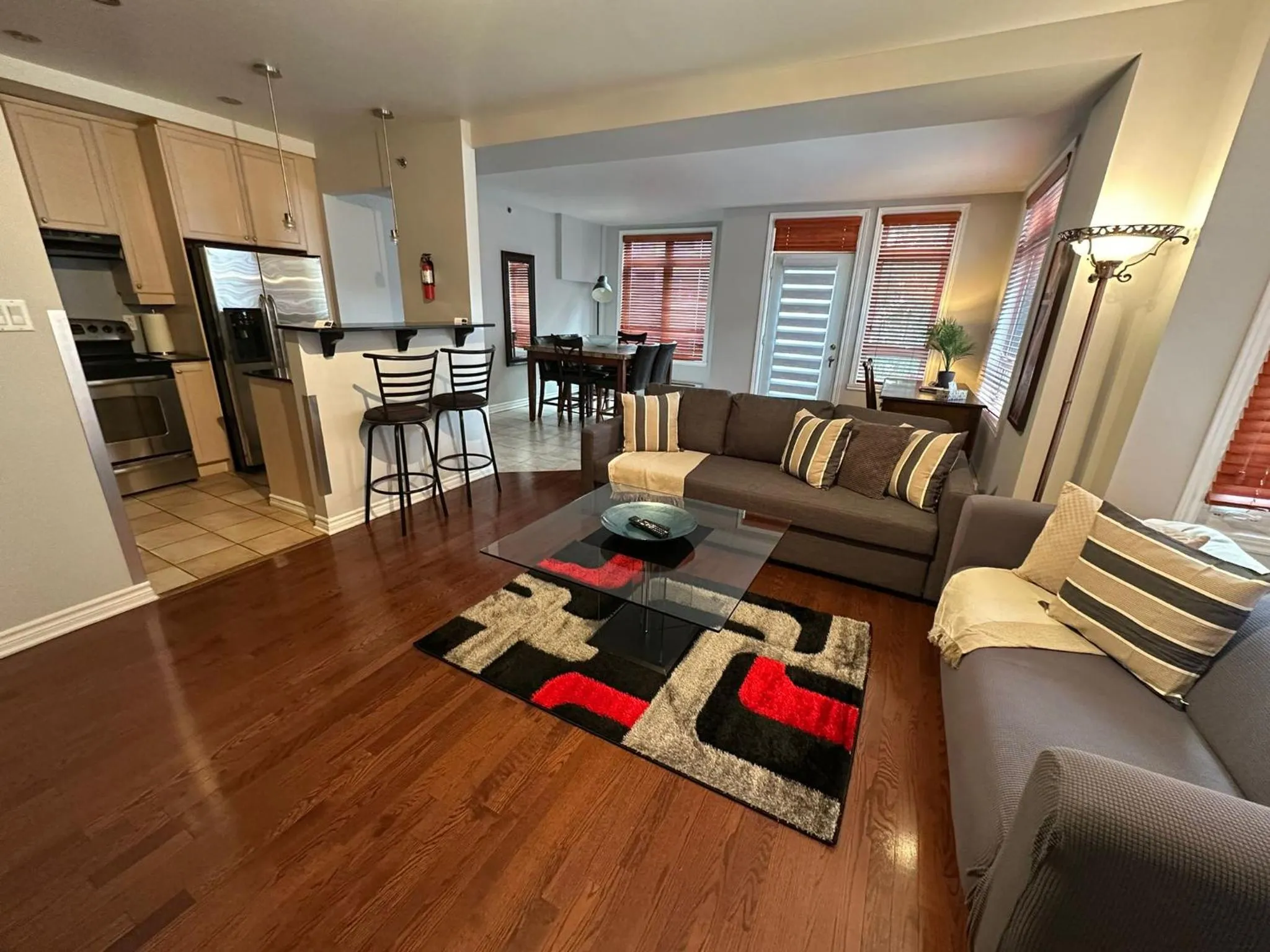 Living room in ApartHotelMontreal by Les Terrasses Saint Urbain 2225I2