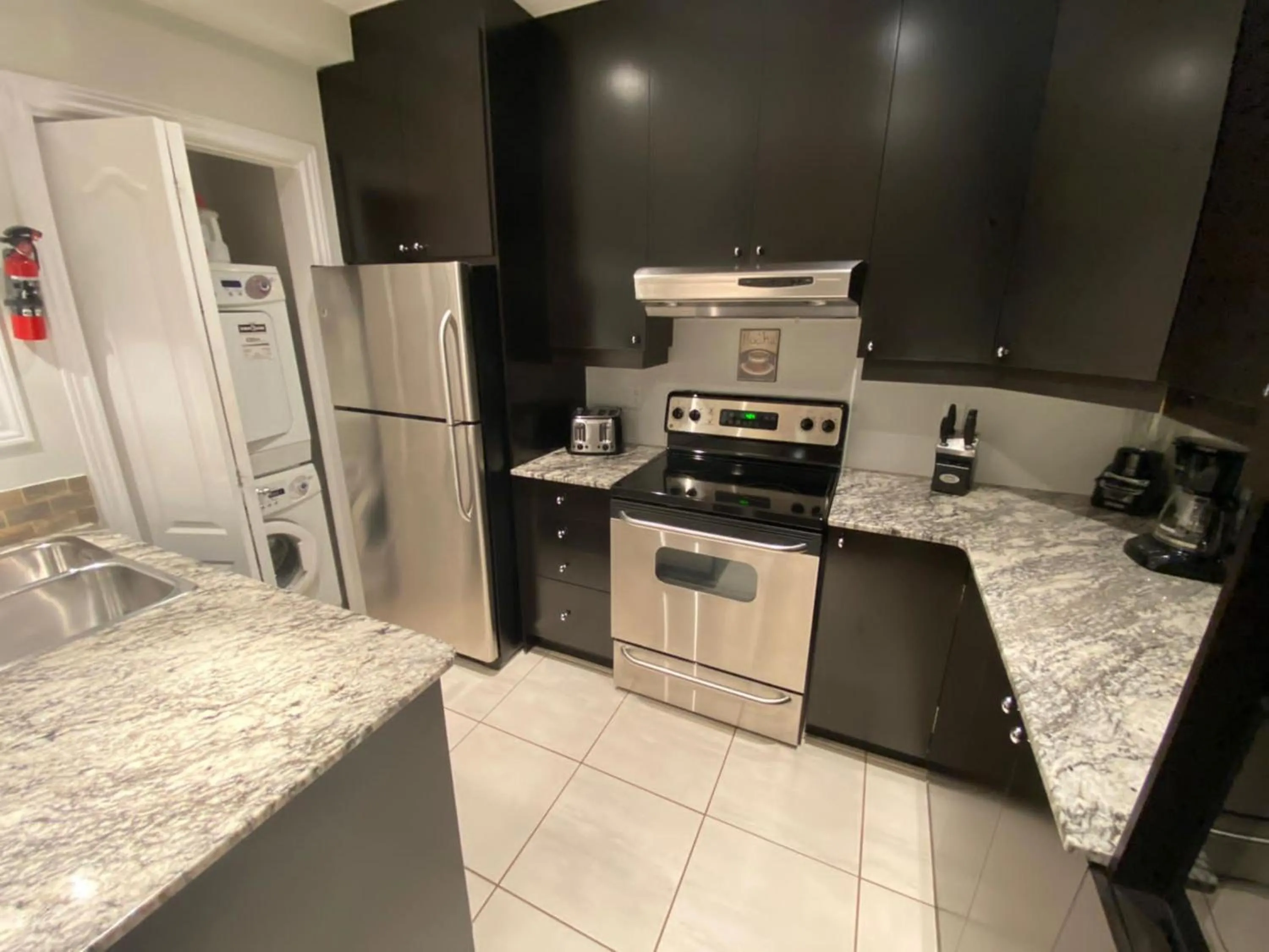 Kitchen or kitchenette in ApartHotelMontreal by Les Terrasses Saint Urbain 2225I2