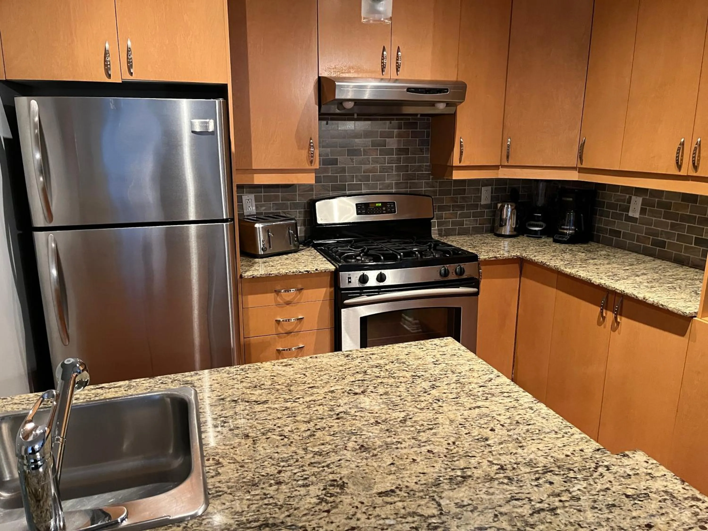 kitchen in ApartHotelMontreal by Les Terrasses Saint Urbain 2225I2