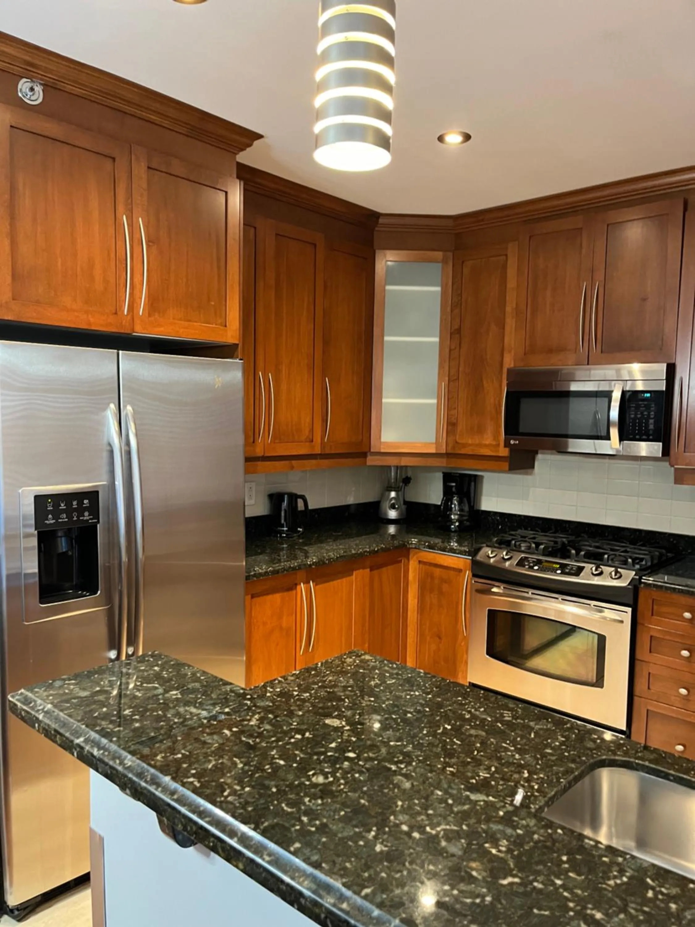 kitchen in ApartHotelMontreal by Les Terrasses Saint Urbain 2225I2