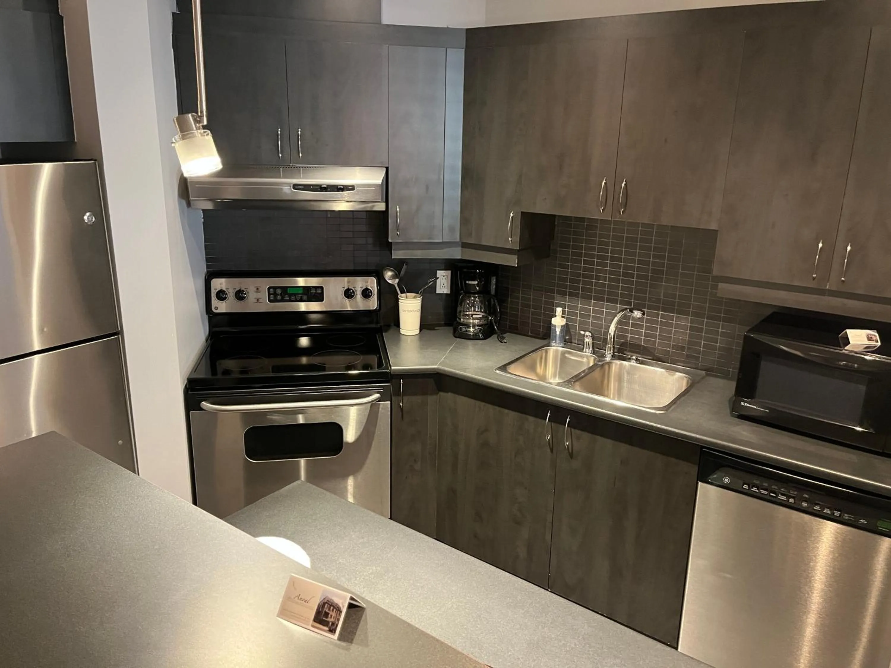 kitchen in ApartHotelMontreal by Les Terrasses Saint Urbain 2225I2