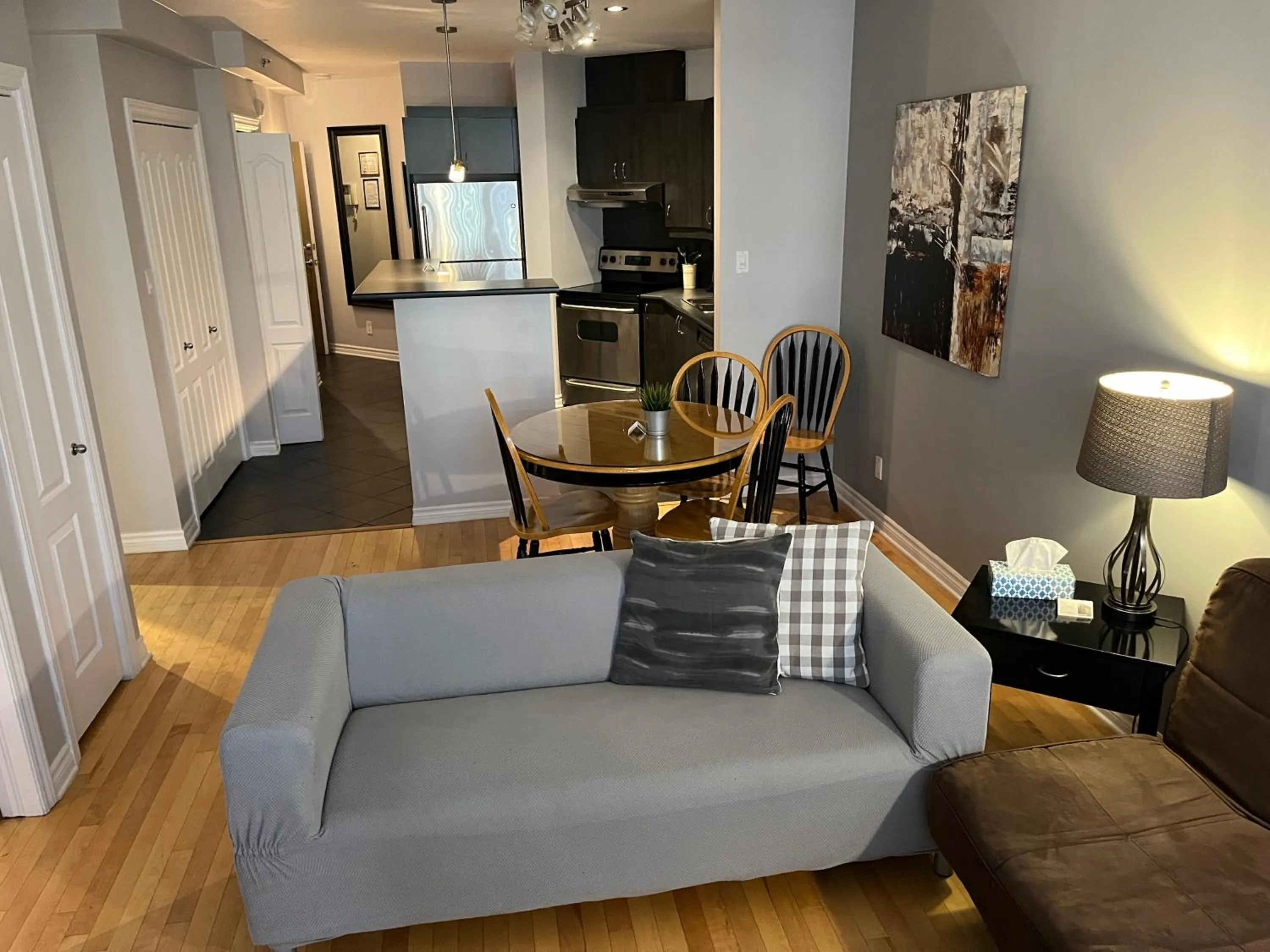 Living room in ApartHotelMontreal by Les Terrasses Saint Urbain 2225I2